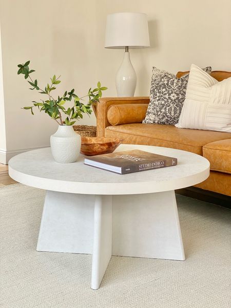 Round white coffee table.

#coffeetable #leathercouch

#LTKhome