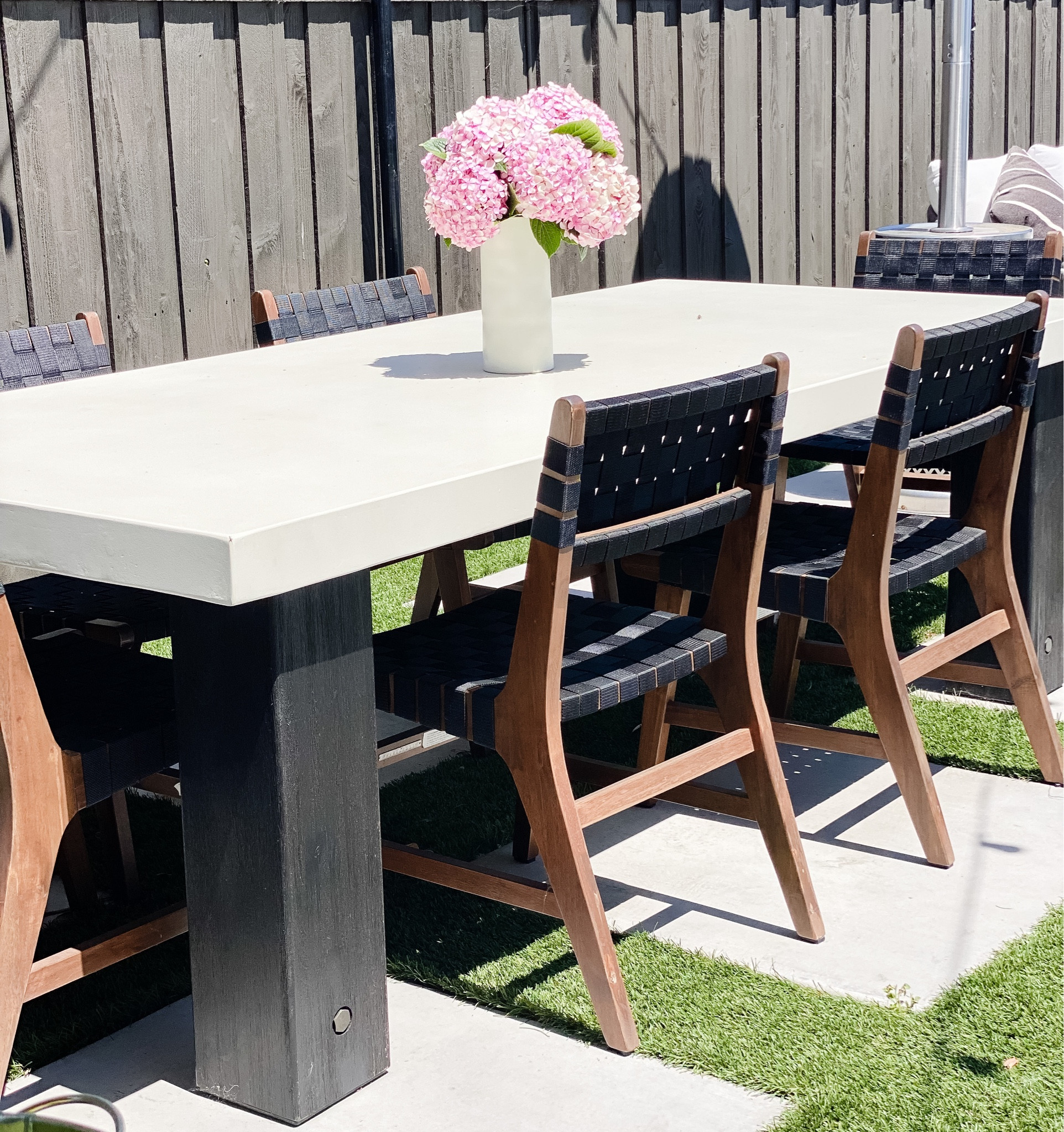 Outdoor furniture clearance starts now and will go through Labor Day - now is the time to start price shopping. But don’t wait too long or risk something going out of stock. 
This concrete table top has been a dream to wipe down, and the chairs don’t get hot despite being in the sun all day. (And very little fading) linking tables and chairs for you to check out 
#outdoorliving 
#outdoorfurniture
#outdoorspaces
#outdoordining 

#LTKhome