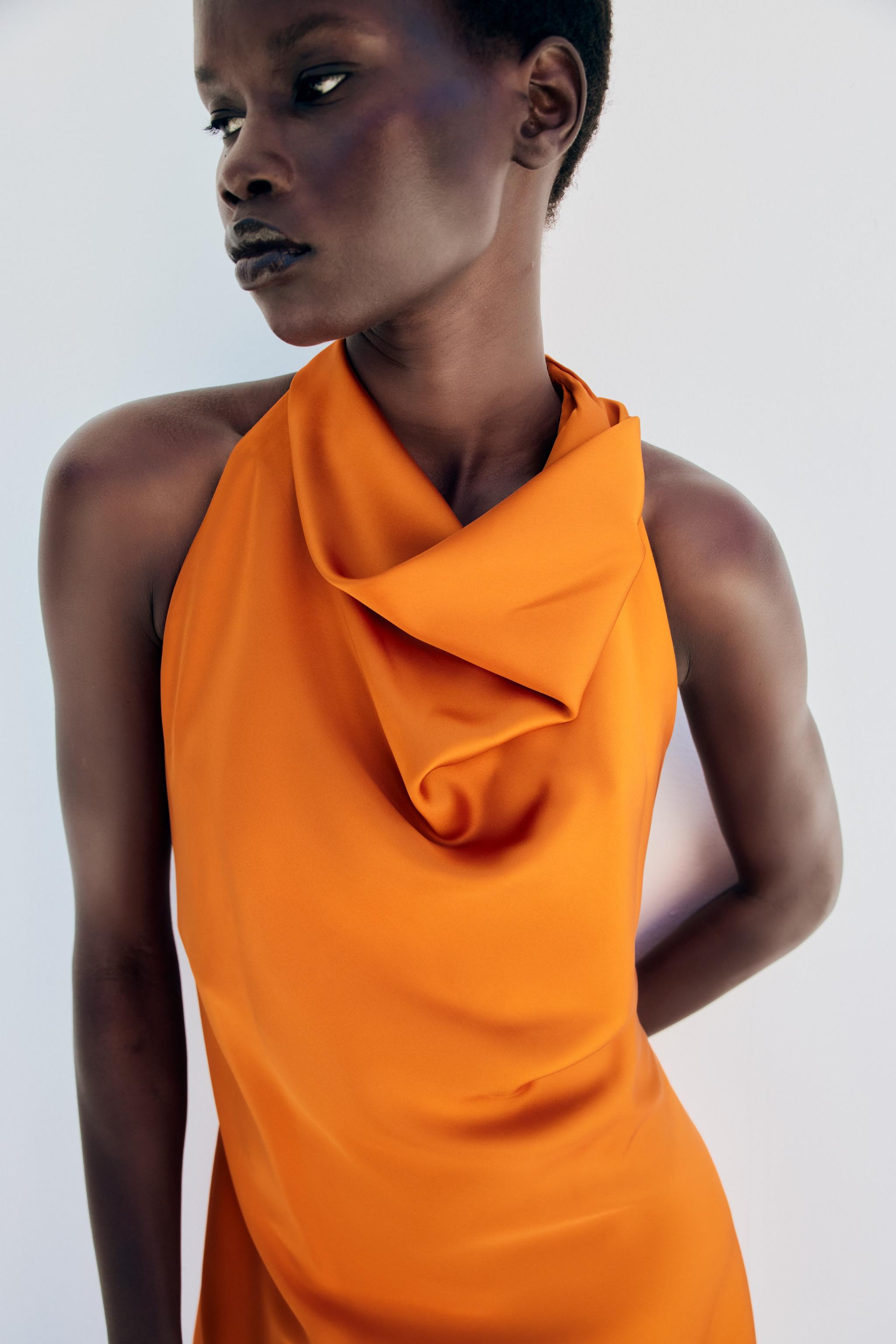 Short halter neck dress. Open back with spaghetti straps and gold-toned ring details. | Zara US
