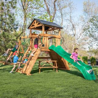 Endeavor II Outdoor Playground Set w/ Elevated Clubhouse, Climbing Wall, Swing Set, Green Wave Slide, and Picnic Bench | The Home Depot