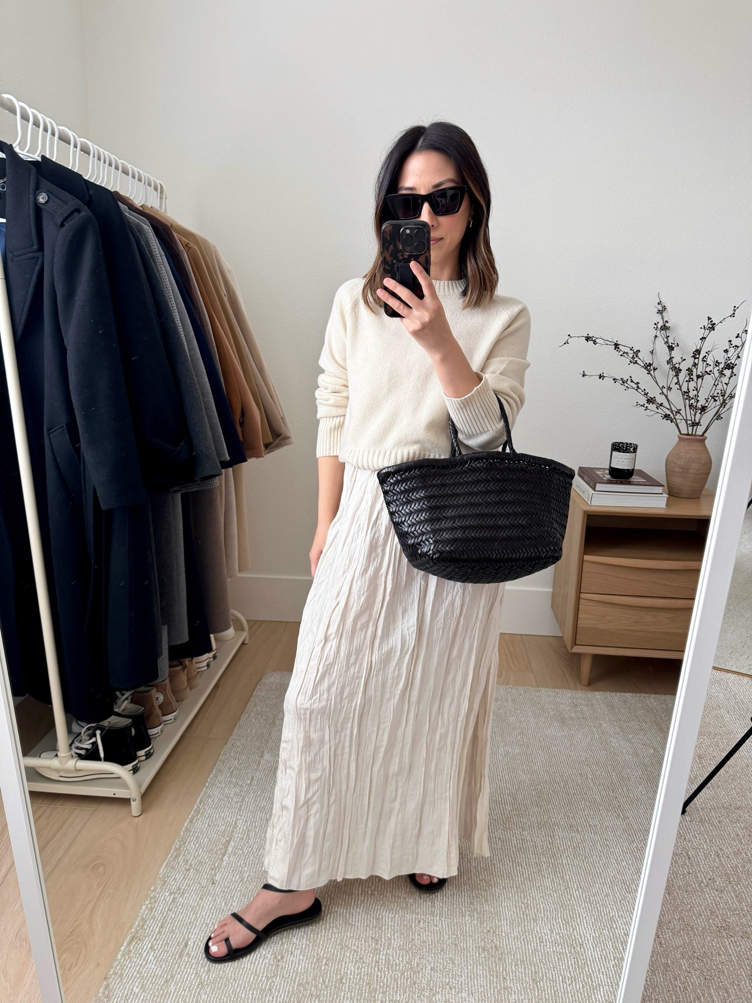 European Travel Capsule Wardrobe outfit. 2 weeks, 70ish degrees, city + beach. 

Everlane cream boxy sweater xs (color is old)
J.Crew crinkle dress xs (old, linked similar)
Tkees sandals 5
Dragon Diffusion Triple Jump Small bag in Black
