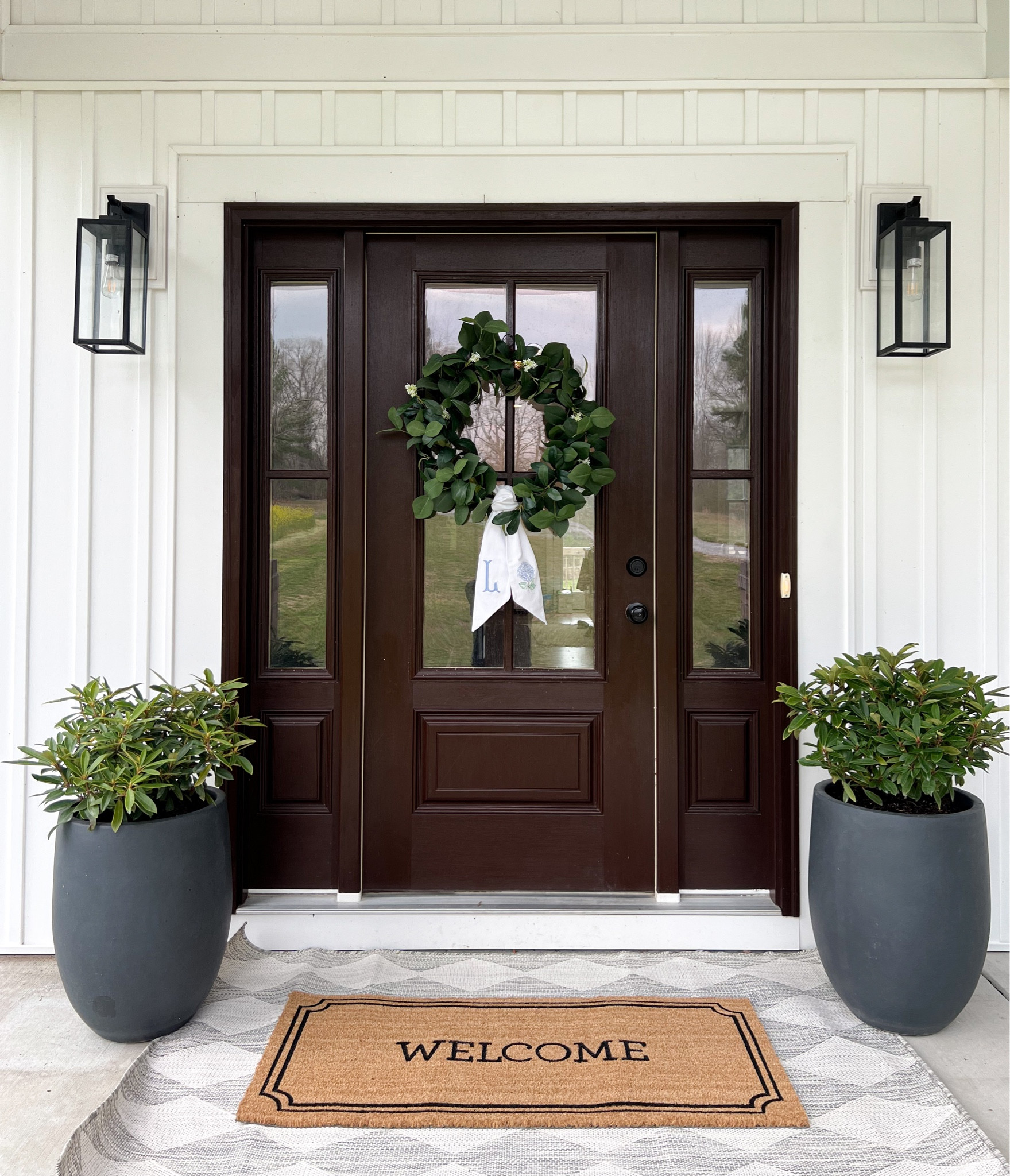Spring front porch
Neutral front porch
Wreath
Planters
Wreath sash
Welcome mat
Area rug
Layering rug