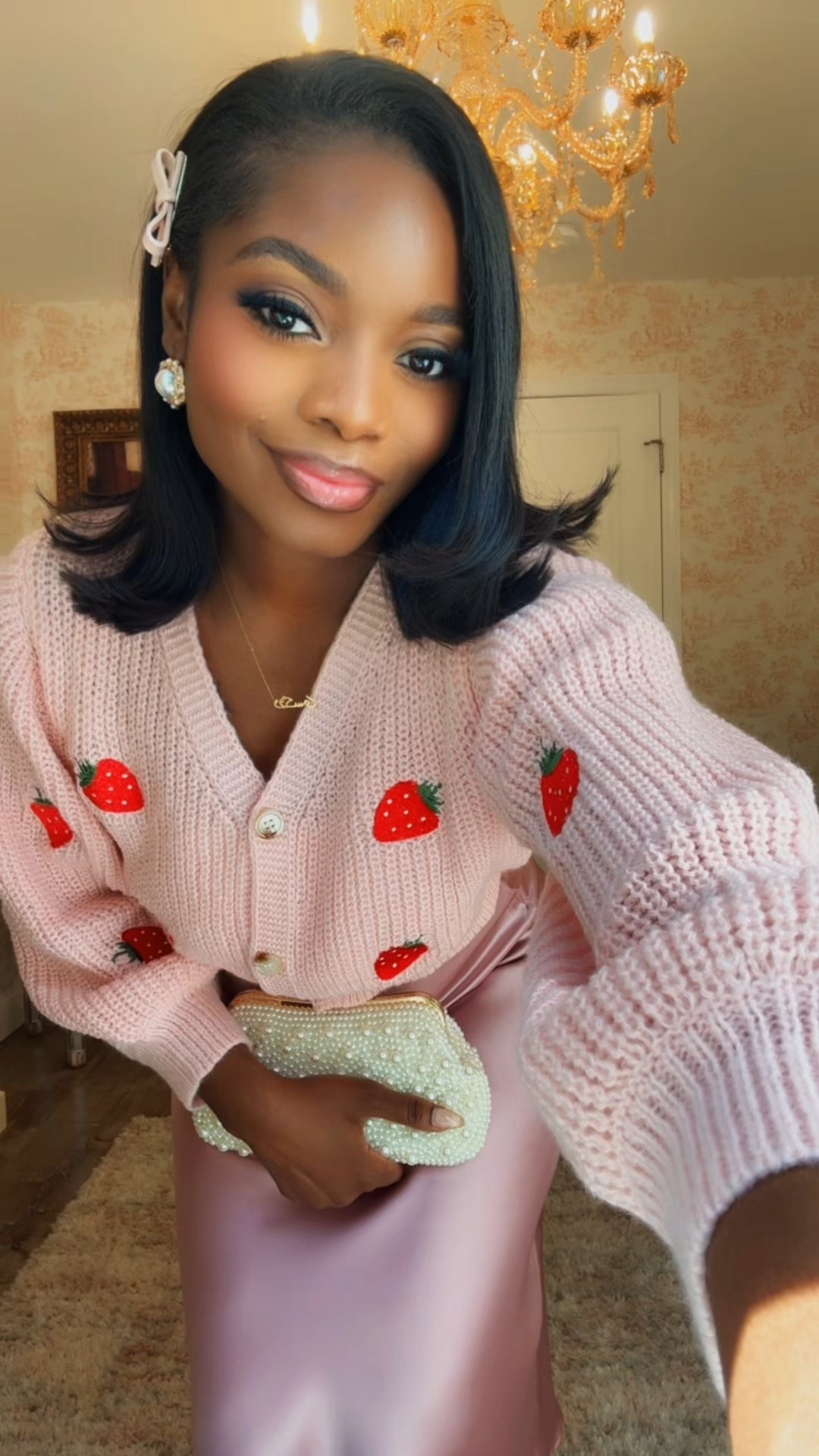 My soul just lives in the 50s mmk ? Lol let’s get into this super cute strawberry sweater , with red Mary Jane’s and satin blush skirt with pearl clutch 🤍

#LTKStyleTip