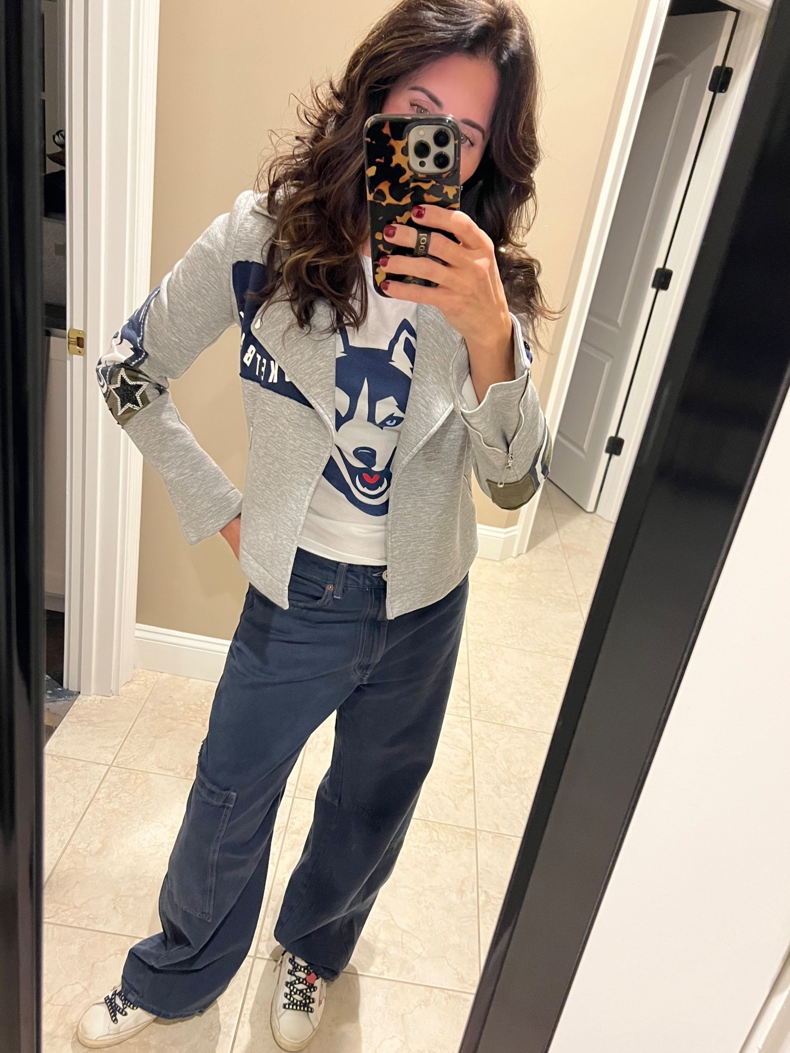 OOTG 11/7/25
Serving looks between plays 🏀💙

Uconn Tee : UCONN Bookstore 
Jeans : Zara TRF Baggy Balloon Jeans (currently unavailable, will link similar style from halara)
Jacket : Custom by tongue tied apparel @tonguetiedapparel on ig 
Sneaks : Customs by golden goose 

All earnings support Connecticut Children’s Medical Center ❤️
#LTKSeasonal #GameDayReady #uconnhuskies #goldengoose #zara #tonguetiedapparel 