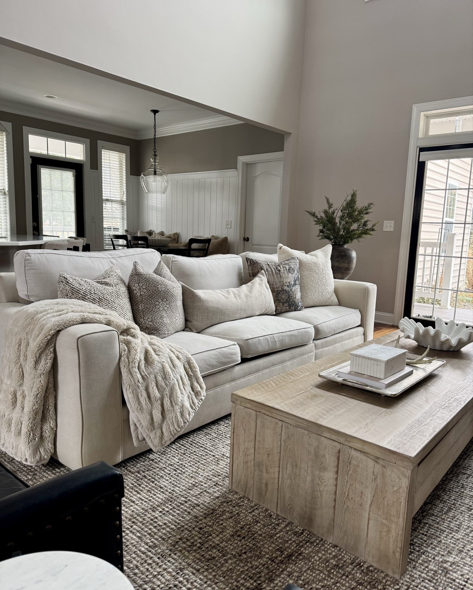 Winter living room layers 🤍 Soft neutrals, warm wood tones, and cozy textures create an inviting space made for slow mornings and relaxed evenings at home.

#LTKhome #LTKseasonal #WinterHome #WinterDecor #NeutralLivingRoom #CozyHome #LivingRoomInspo #ModernTraditional #HomeInspo #StyledHome #mypotterybarn
