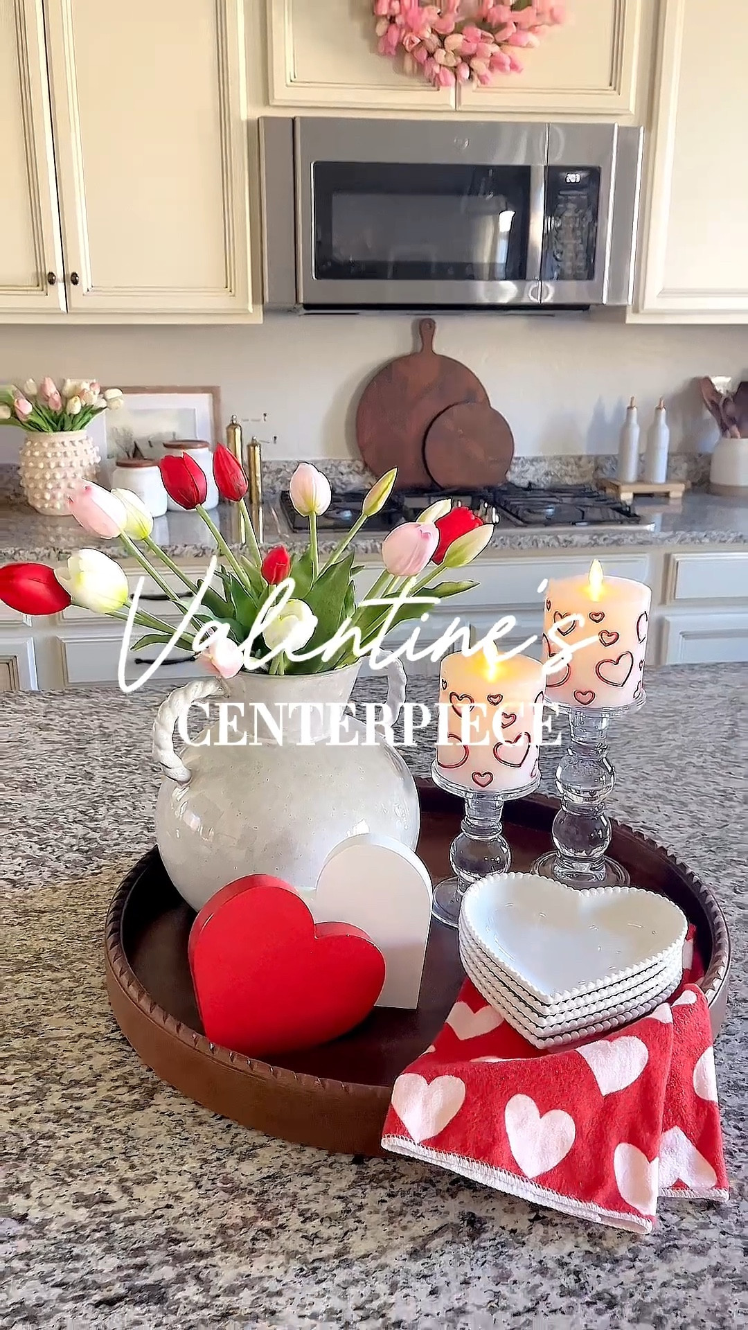 VALENTINE'S DAY tray styling! 

Follow @lifeinmyarizonahome
on Instagram for more inspiration.

These beautiful tulips are so realistic looking and I love the gorgeous detail on the heart plates. The luminara flameless candles are my absolute favorite and so realistic looking. The heart design is just adorable right now!  This is such a simple way to add a few Valentines touches to your home  

Wood round tray | real touch tulips | glass candle holder | luminara flameless heart candle | wood heart decor | heart towel | white heart plates

#valentinesdecor #traystyling
#homedecor

#LTKValentine #LTKHome #LTKSeasonal