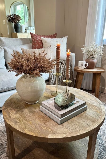 Cozy Family Room Space. Follow @farmtotablecreations on Instagram for more inspiration. Down filled couch. Laurel and Blush Pillow Covers. Surya Rug. Round Coffee Table. Fall Coffee Table Decor. Cozy Home Touches

For Reference: 3 stems used in coffee table vase, 1 stem used in accent table vase. 

#LTKunder50 #LTKFind 

#LTKhome