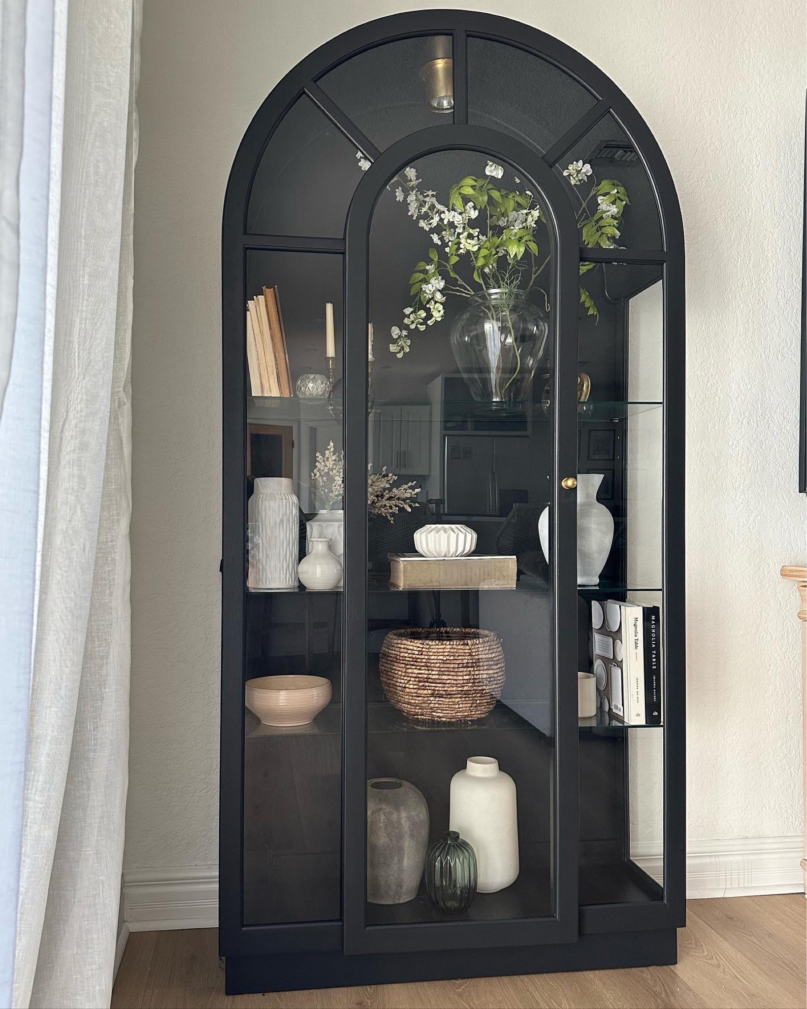 Arched black clearance cabinet