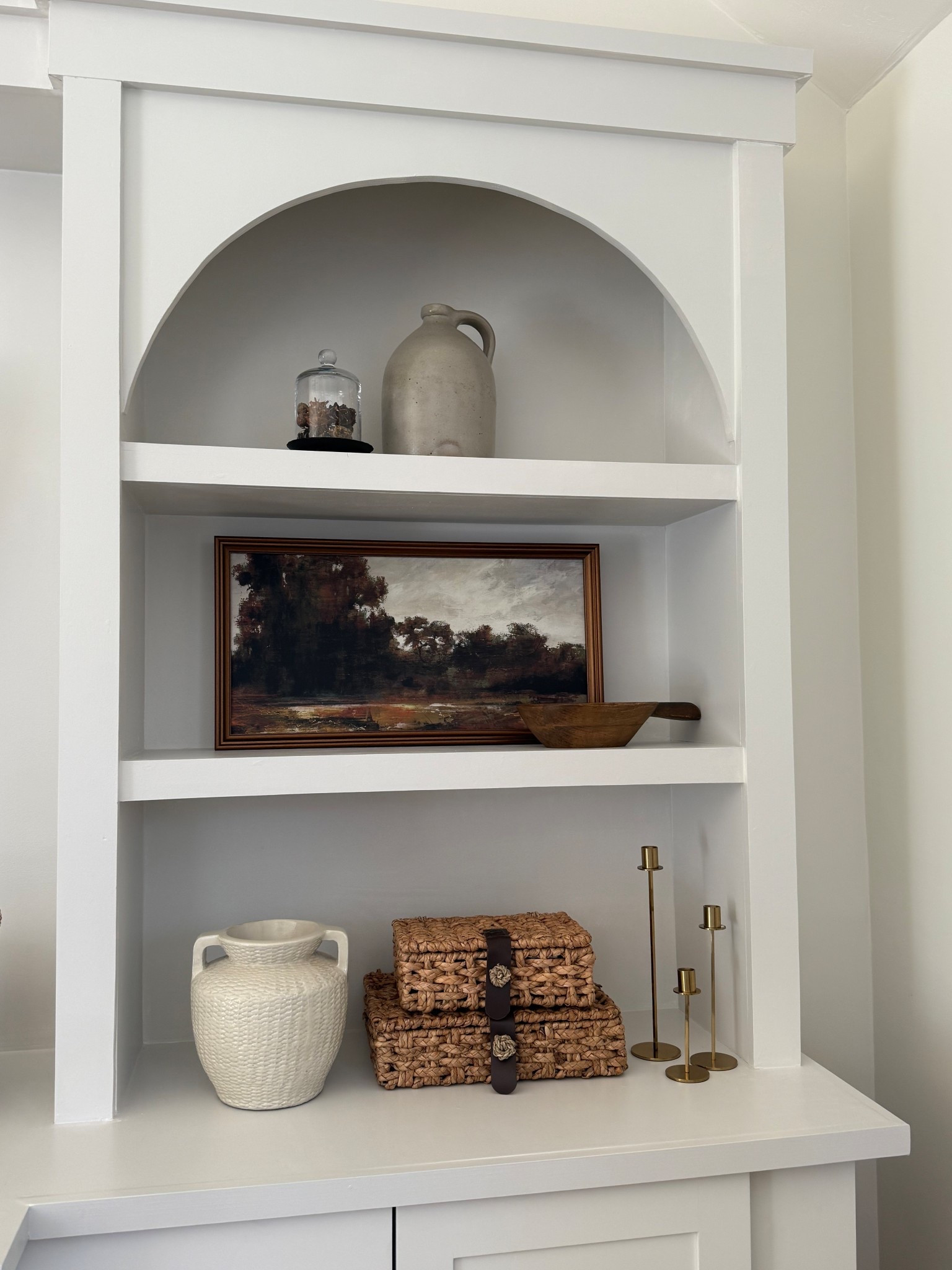 Canvas framed artwork is on sale today! These moody colors would look great all year long. I appeared it with woven boxes and a pretty neutral vase and some gold candlesticks..

#LTKHome #LTKSaleAlert