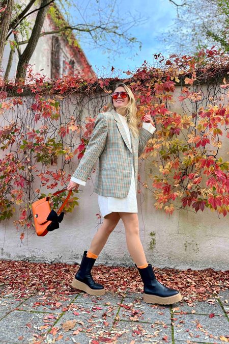 Knit Dress. Fashion Blogger Girl by Style Blog Heartfelt Hunt. Girl with blond hair wearing an oversized knit dress, plaid blazer, orange sunglasses, orange bag with bow detail, orange socks and chunky chelsea boots. #knitdress #colorfuloutfit #colorfulstyle #colorfulfashion #colorfullooks #fashionfun #cutefalloutfit #fallfashion2023 #falllookbook #fitcheck #dailylooks #dailylookbook #contentcreator #microinfluencer #discoverunder20k