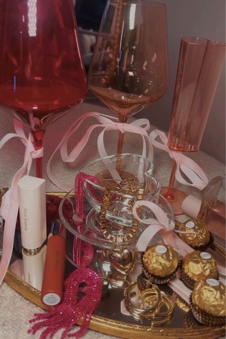 Valentine’s Day gift ideas! Colored glass stemware… pink wine glasses and champagne flutes 🥂 heart shaped gold accessories… valentines necklaces and sparkly earrings. Rare beauty lipstick in the shade BOLD and rare beauty lip oil in shade Honesty! 
.
.
.
.
.
.
.
#sephora #sephorafinds #beautyfinds #valentinesday #weddingguestlist

#LTKwedding #LTKGiftGuide #LTKbeauty