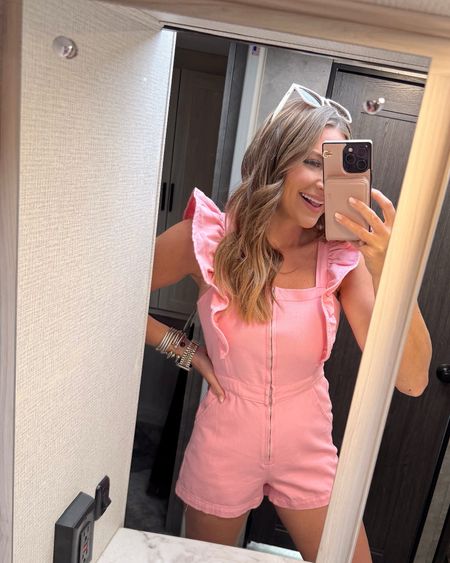 In a medium pink denim romper with ruffle sleeves, sunglasses and accessories for spring - all fits TTS.

#LTKfindsunder50 #LTKSeasonal #LTKstyletip