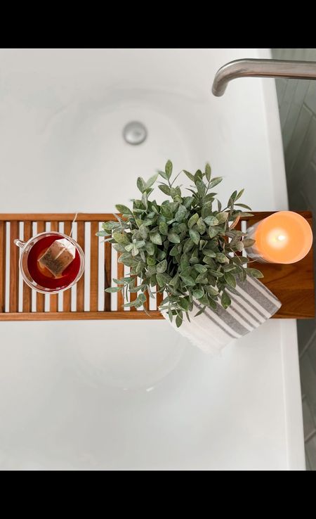 I adore this bathtub caddy from Target. It seamlessly blends relaxation with practicality. Not only do I appreciate how it ‘prettifies’ my bathroom, but it also helps organize my essential items for a relaxing bath. Whether it’s a candle, a favorite book, a cup of tea, or a bag of chips 🤪 (some days are tougher than others) this caddy truly shows up for me. 🤗 🤎

#LTKhome #LTKfamily #LTKVideo