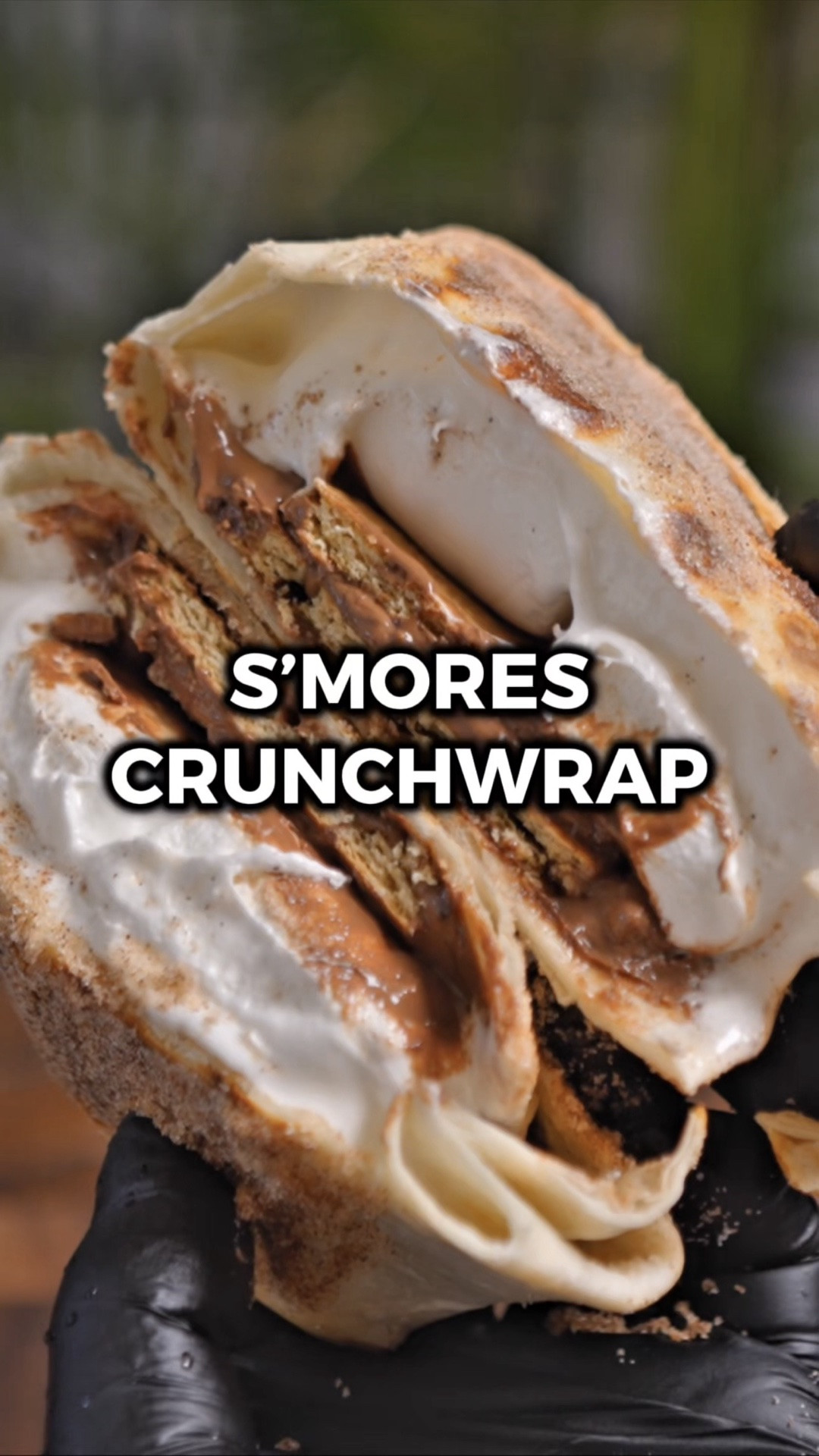I first saw this S'mores Crunchwrap from @dowellcooks and I knew I had to try it. He's got awesome recipe content so check him out if you haven't already! 🙌

It's crispy on the outside with gooey melted marshmallows and chocolate in the middle. Everything you love about s'mores but in crunchwrap form. The cinnamon sugar coating on the outside takes it over the top.

Would you try it? Let me know in the comments what you think if you do! 🙌

INGREDIENTS
1 large tortilla
4 jumbo marshmallows
1 graham cracker
1 Hershey's chocolate bar
1 small tortilla
3 tbsp sugar
1 tsp cinnamon
cooking spray

INSTRUCTIONS
1️⃣ Place the jumbo marshmallows in a square in the center of the large tortilla.
2️⃣ Place the graham cracker on top.
3️⃣ Place the Hershey's chocolate bar on top.
4️⃣ Place the small tortilla on top.
5️⃣ Fold in the edges of the large tortilla to enclose everything.
6️⃣ Lightly spray a pan with cooking oil and place the crunchwrap small tortilla side down over medium heat. Cook for 2-3 minutes or until golden brown and the folded edges stay sealed.
7️⃣ Flip and cook the other side for another 2 minutes or until golden brown.
8️⃣ Mix the sugar and cinnamon together and coat the outside of the crunchwrap.
9️⃣ Enjoy!

#LTKfoodie #LTKHome