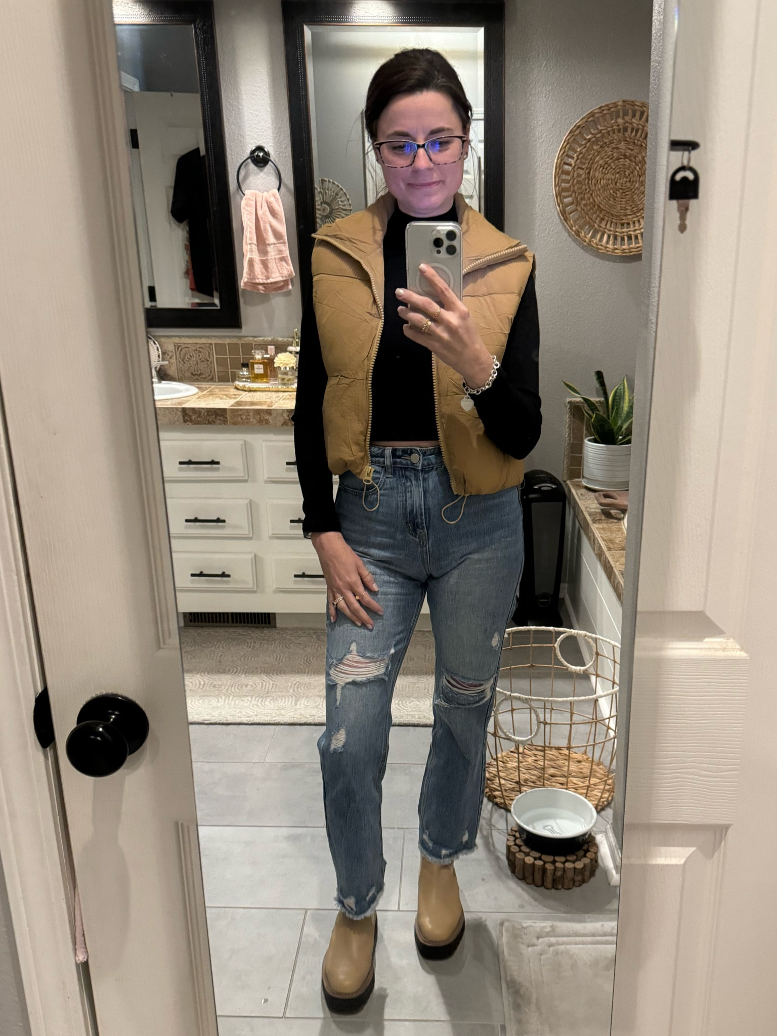 Wow - this vest is amazing!  I’m there for it!  You can clip a 10% coupon for it right now!!!  Runs a tad bit big but I am in my normal size small. I’m wearing a medium in crop top (for extra length) and 24 in jeans. Jeans have NO stretch. Boots are TTS. 

#LTKover40 #LTKsalealert #LTKfindsunder50