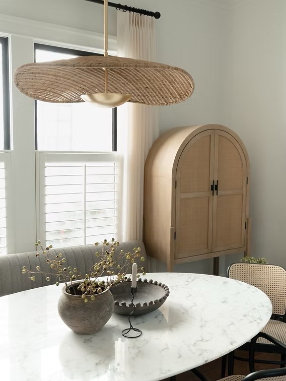 Parisian dining room, rattan chic iconic chandelier, dining room chandelier, rattan brass, rattan drink cabinet, tulip table, banquette.
#organicmodern #diningroomdecor #europeandesign 

#LTKHome