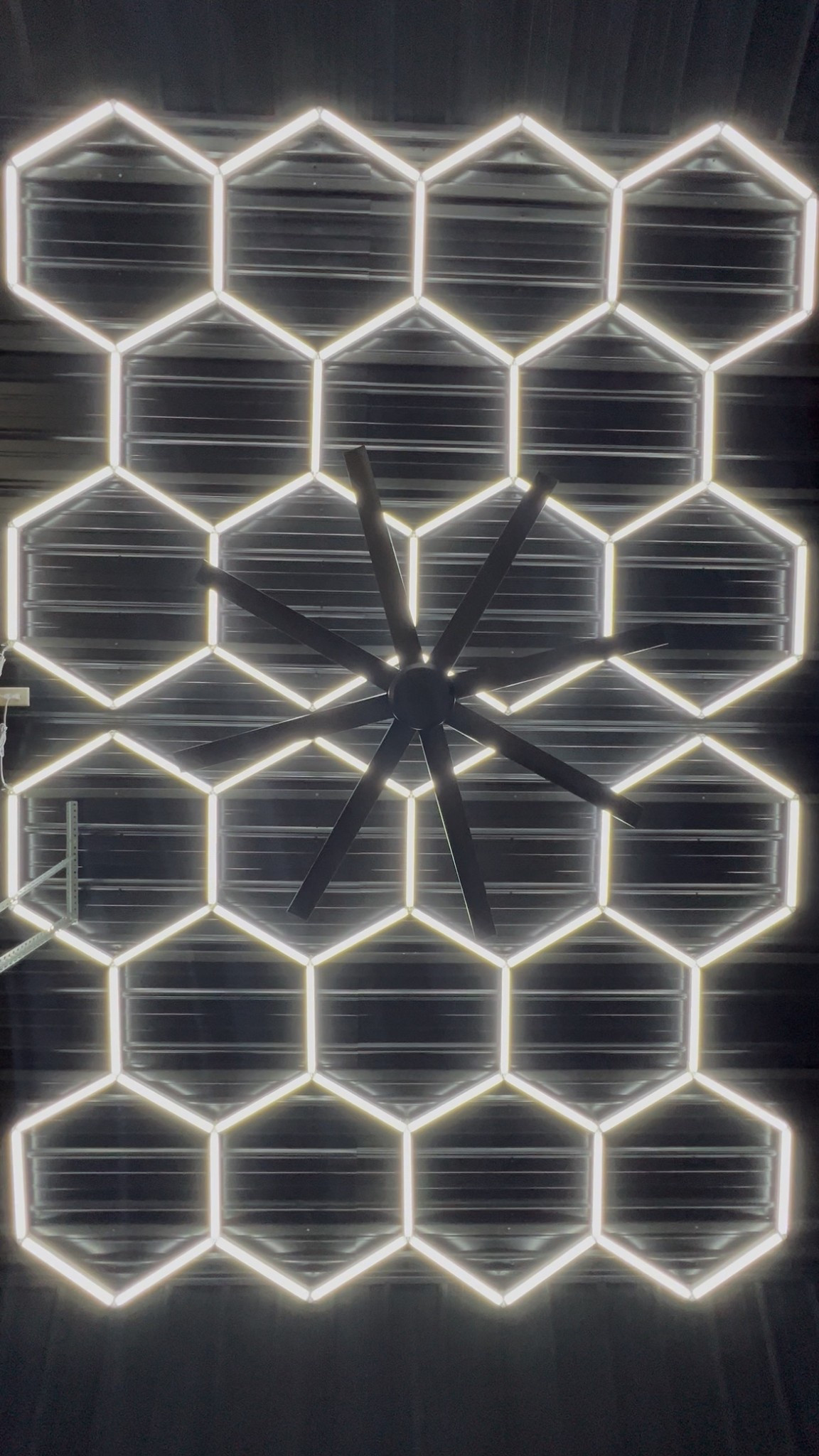 Lights, fan and wood paneling