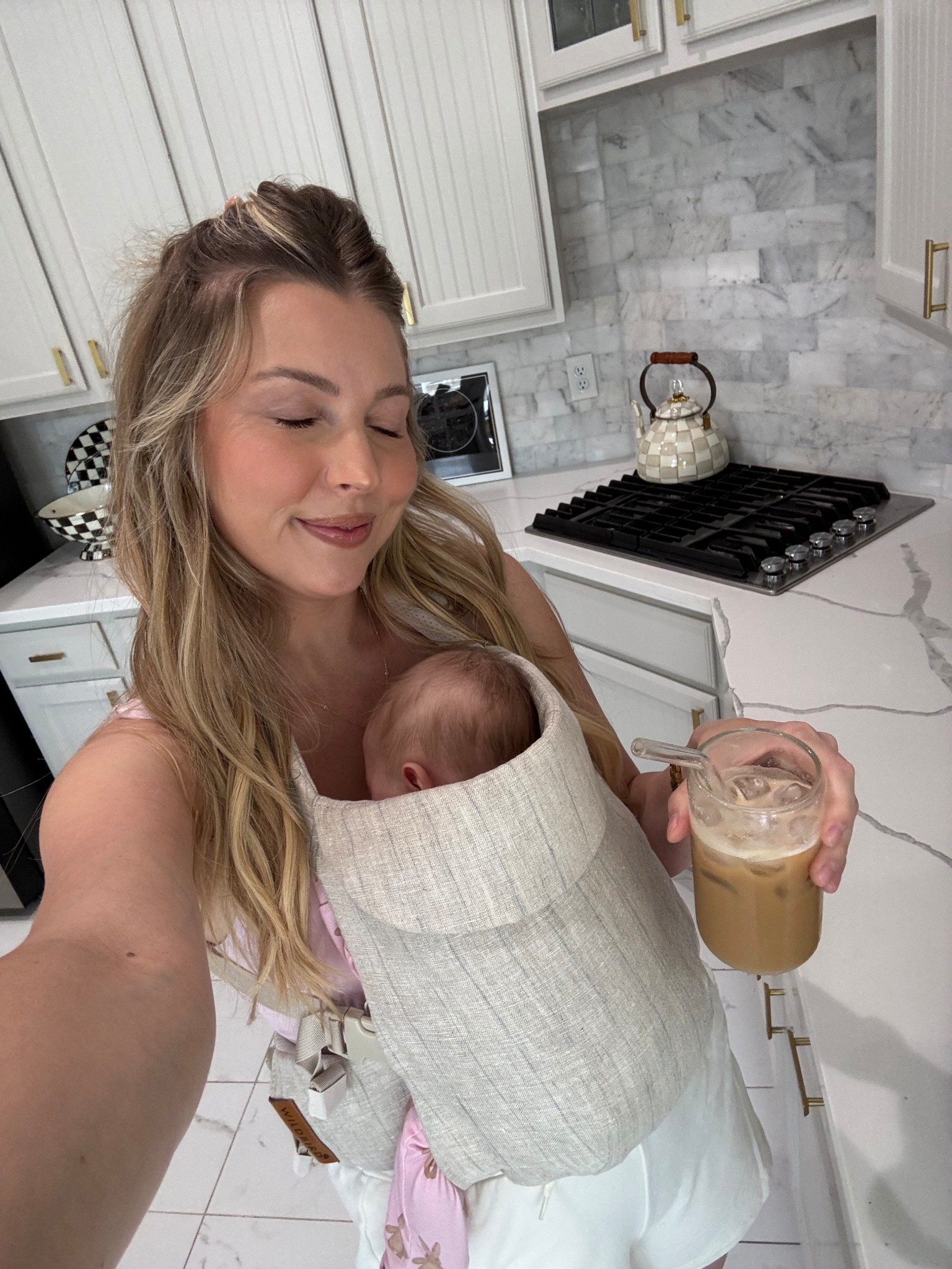 Comfy outfit + a fave baby carrier of mine! Wearing a M in my sports bra tanks easy and shorts.

#LTKFamily #LTKBaby #LTKTravel