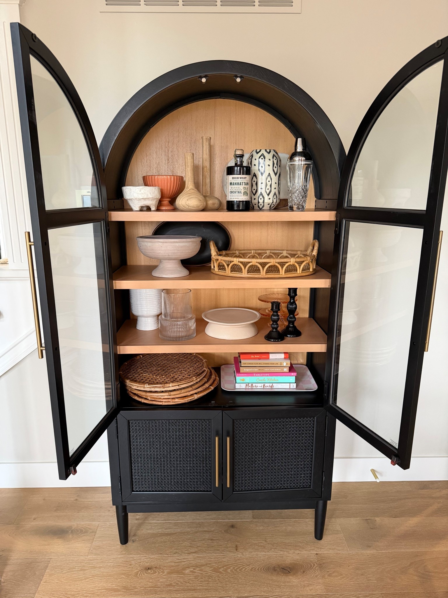 Black arched cabinet to hold all the things. 

Decor, party gear, seasonal items, etc. I love this and all that it holds!

#LTKHome #LTKSaleAlert