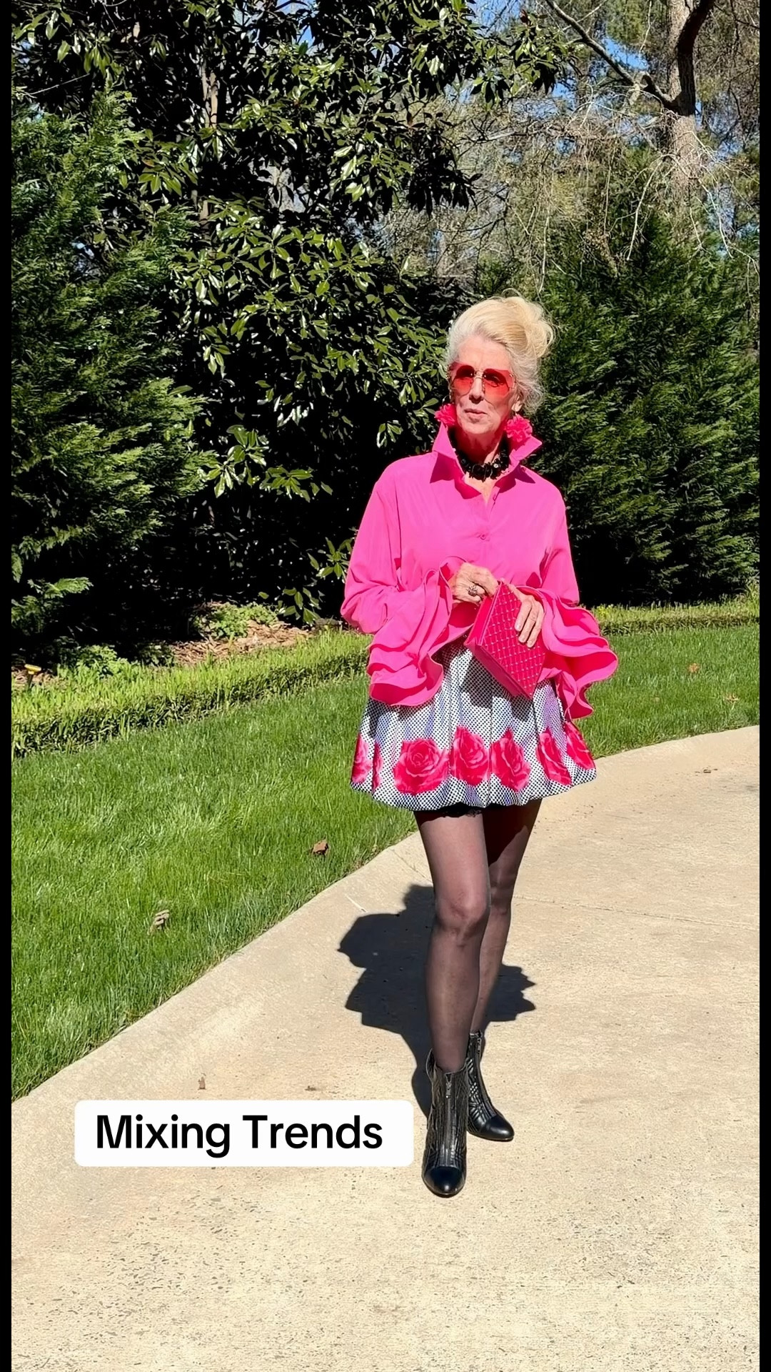 Trending mix and match outfit. Florals, polkadots, ruffle sleeve, wide belt, clutch purse, large sunglasses and pointed toed booties giving a playful Betsey Johnson vibe. So fun! #fashion #fyp #trending #pink #over40 @betseyjohnson

#LTKootd #LTKBeauty #LTKOver40