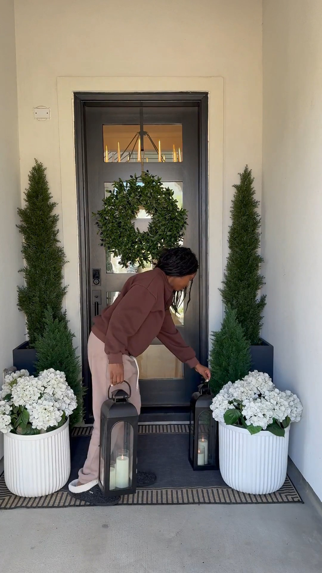 Want to effortlessly elevate your home decor with the changing seasons? ☺️

Here's a simple yet impactful styling tip: focus on swapping out just three key elements - your wreath, rug, and trees! This approach allows you to curate a fresh new look without overhaulng your entire space! 🤎

I personally love styling artificial trees and faux hydrangeas throughout the year, as they add a touch of natural beauty to any outdoor space. 

To complete the look, consider adding a few complementary pieces, such as:

•  A rug in a neutral tone to tie everything together - mine is 4'x6'

•  White planters to add a pop of crisp elegance - mine are Large size

•  A assortment of lanterns in varying sizes - (2 large, 2 medium, 2 small) to create visual interest and depth

By making just these few strategic swaps, you can create a cohesive, stylish space that effortlessly transitions from one season to the next! 🤍

Let me now, are you loving this look? 🤎

#LTKHome #LTKStyleTip #LTKSaleAlert
