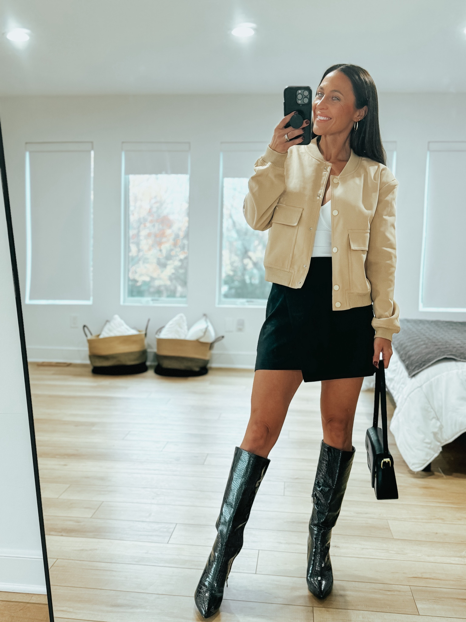 Cropped bomber jacket, mini skort, knee high boots, black purse 

#LTKStyleTip #LTKFindsUnder100 #LTKCyberWeek