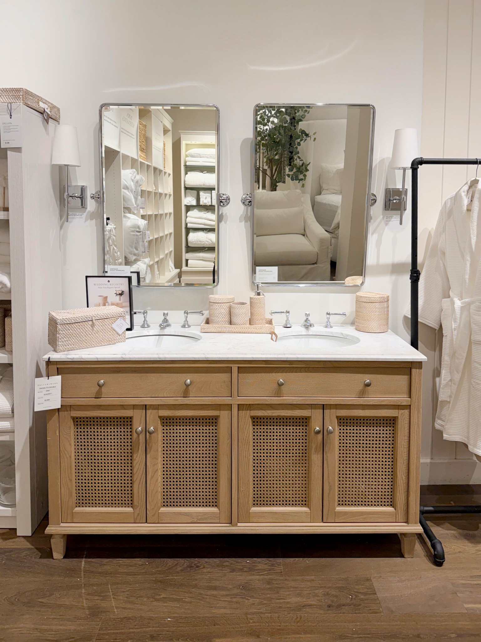 A luxe bathroom moment! 😍 The Sausalito 60” Double Sink Bath Vanity from Pottery Barn blends warmth and elegance with its solid elm wood frame, woven rattan detailing, and stunning honed Carrara marble top. 🤍 The natural veining in the marble makes each piece feel unique, while the roomy cabinet with adjustable shelving keeps everything beautifully organized. 💫 Shown here in thee  seadrift color - it’s spacious, refined, and brings that spa-like, warm-and-inviting feel to a primary bath. A true statement vanity that elevates the entire space. Linked here! 🫶🏻 #PotteryBarn #BathroomInspo #BathroomVanity

#LTKSaleAlert #LTKHome