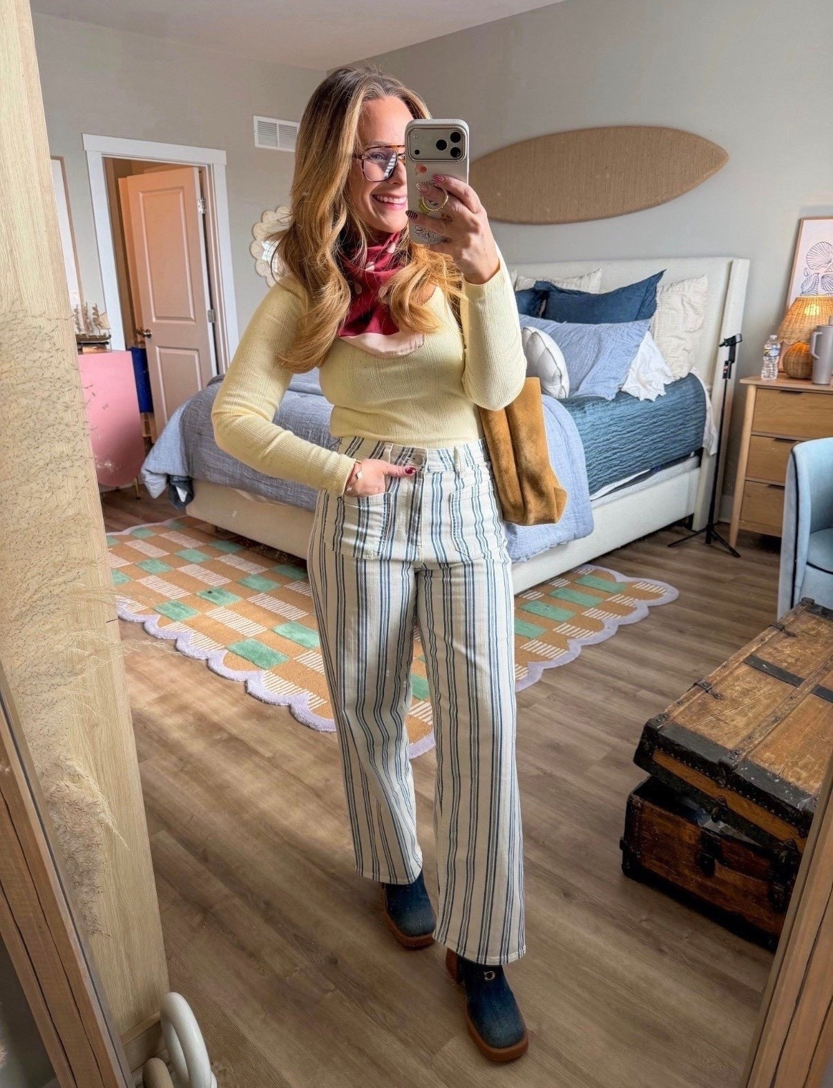 Okay wait… this might be my favorite look lately 🤎

These striped trousers are SO good — flattering high rise, subtle flare, and the vertical stripe makes your legs look miles long. Paired with a fitted knit and a little scarf moment for that effortless, slightly vintage vibe.

It feels polished but still fun. Perfect for brunch, errands, or when you want to look styled without overthinking it.

Fit notes:
• Pants are true to size with a structured feel
• High rise + elongating stripe
• Knit top is fitted (size up if you want a looser fit)

Linking everything here 🤍 This is one of those outfits that makes you feel put together instantly.