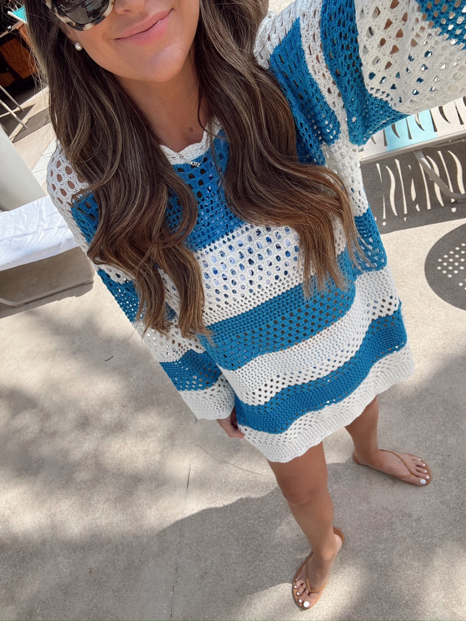 In a large crochet coverup dress, large 2 piece swim underneath, sandals, sunglasses & accessories - fits tts.

#LTKStyleTip #LTKFindsUnder50 #LTKSwim