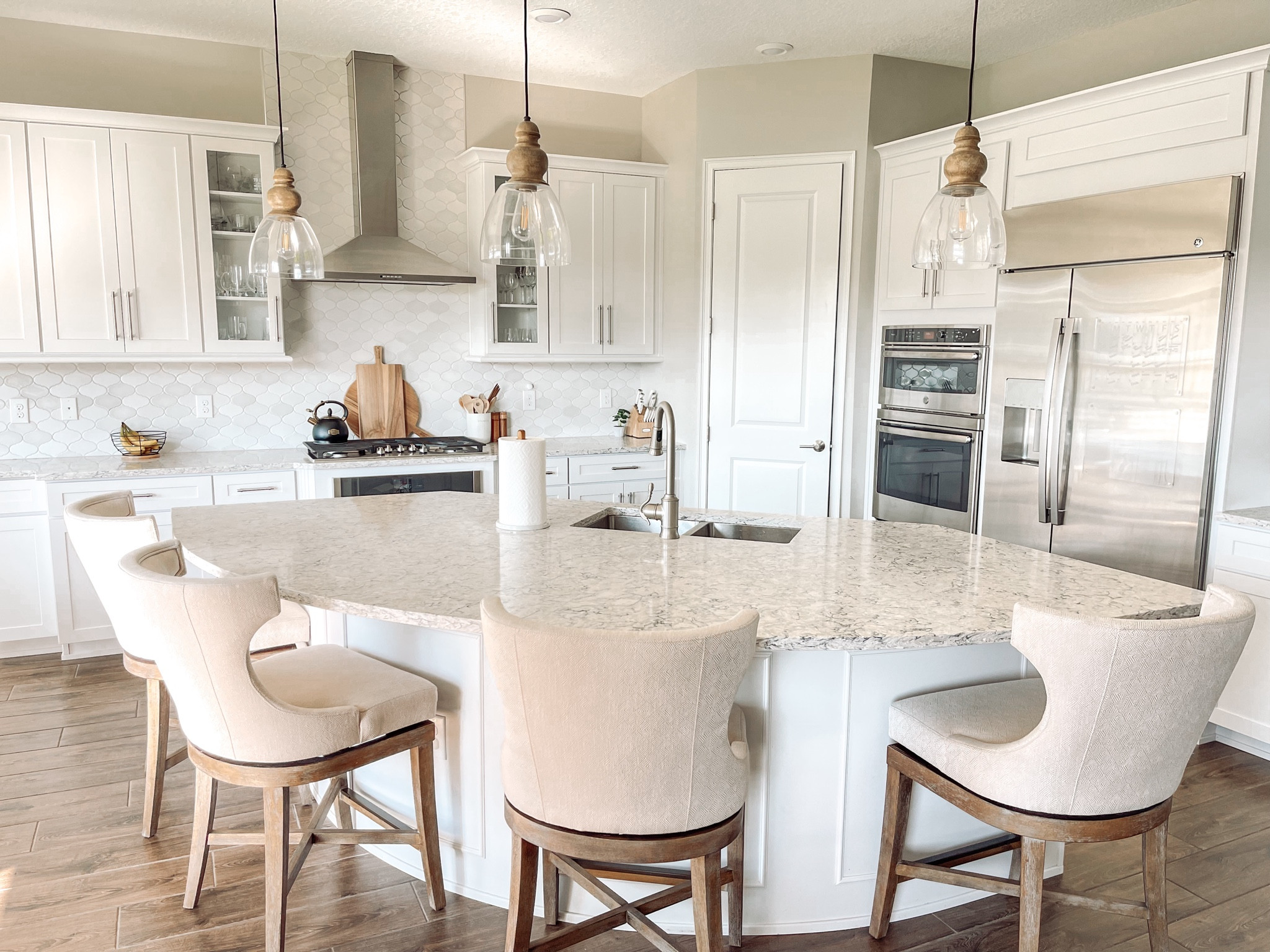 Clean and crisp white and neutral kitchen. These barstools have been a favorite home purchase and the best part… they swivel!

#LTKsalealert #LTKGiftGuide #LTKhome