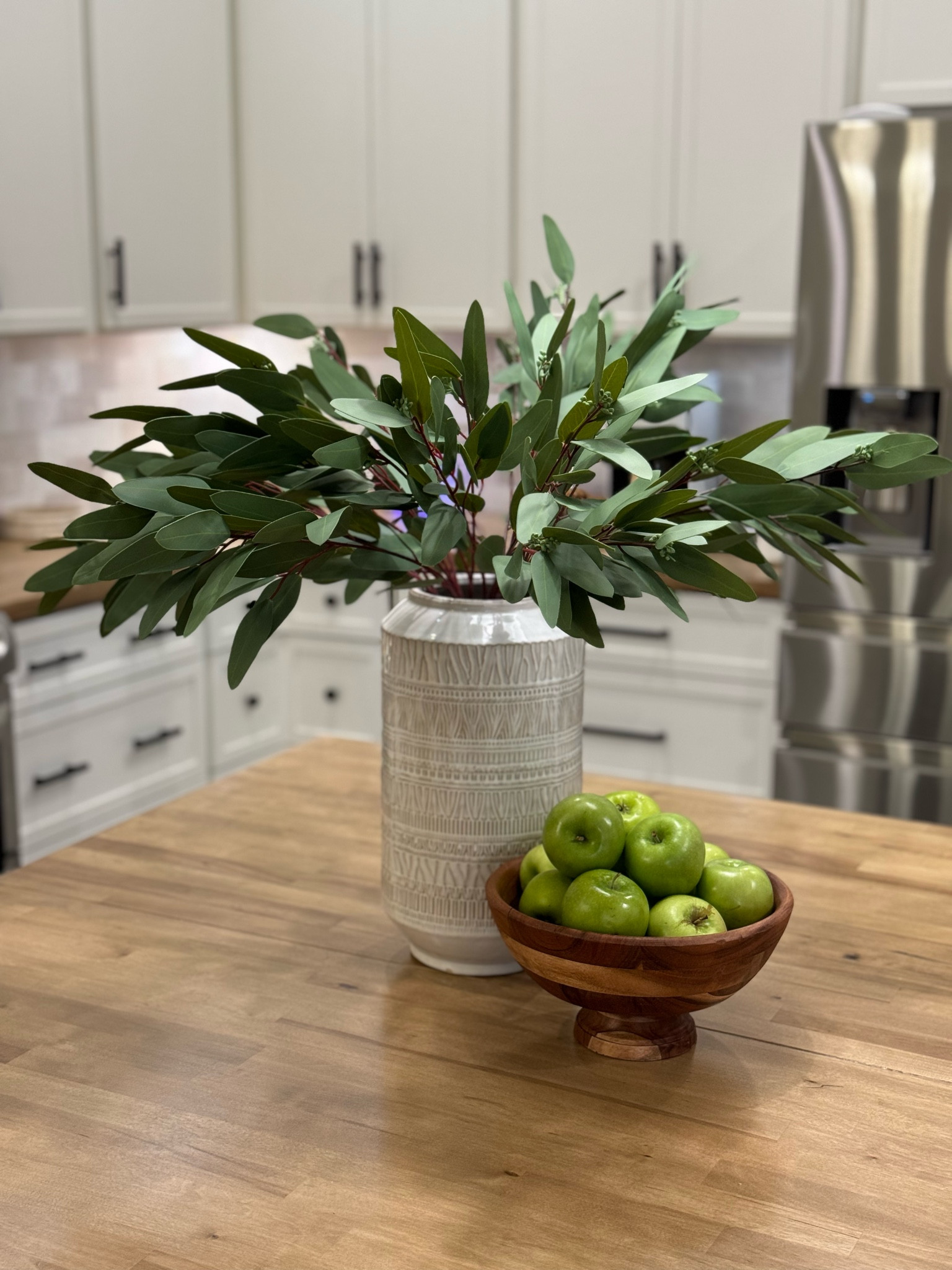 Loving these faux eucalyptus stems I added to our kitchen. They’re a great faux! I have 9 stems here. 

#LTKhome
