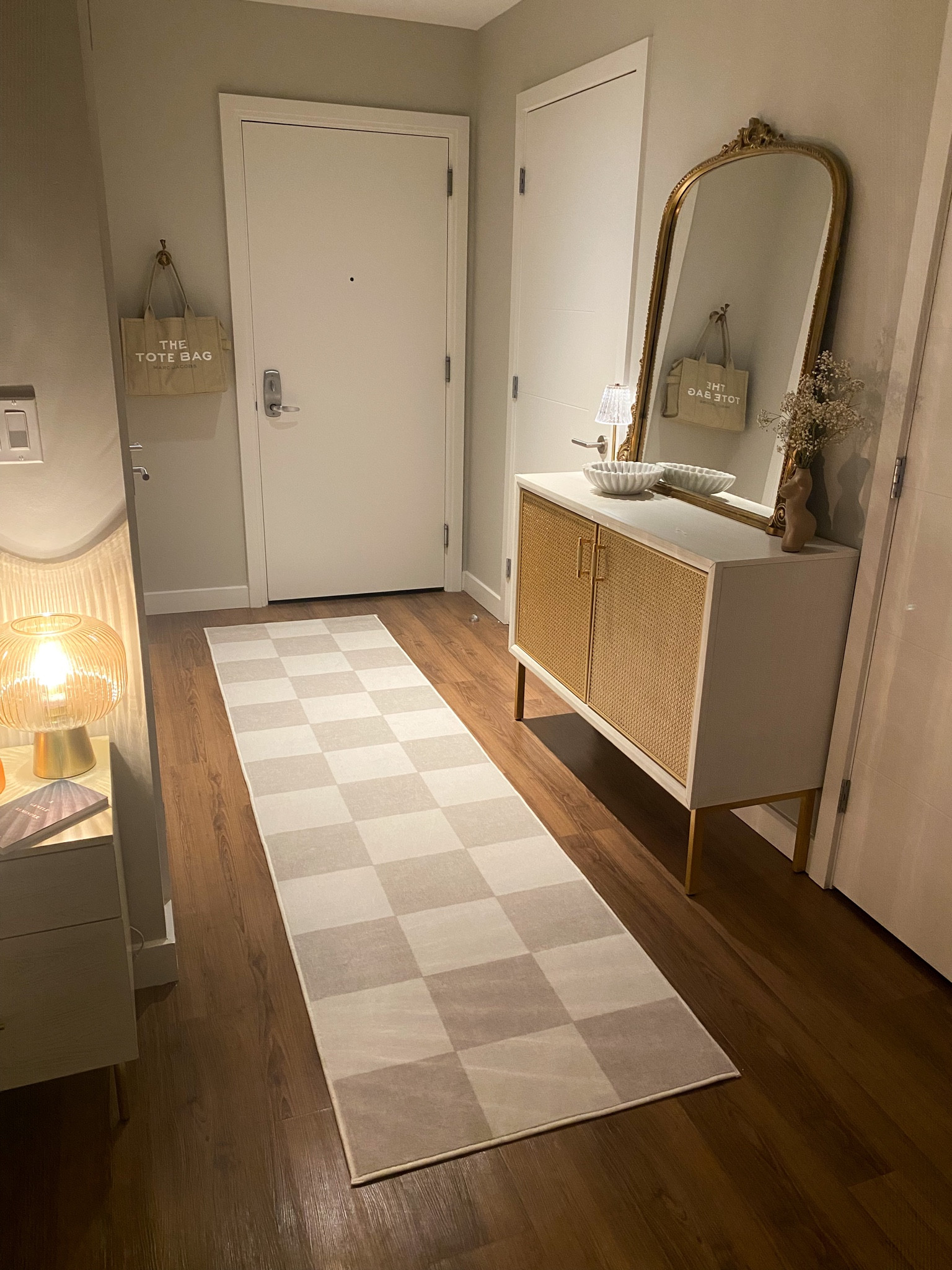 Loving this checkered runner rug for my entryway! 
-
Home decor, Anthropologie mirror, scalloped bowl, studio apartment, target sideboard, Ruggable, handbag hook, marc Jacobs tote, amazon table lamp

#LTKhome #LTKfindsunder50 #LTKfindsunder100