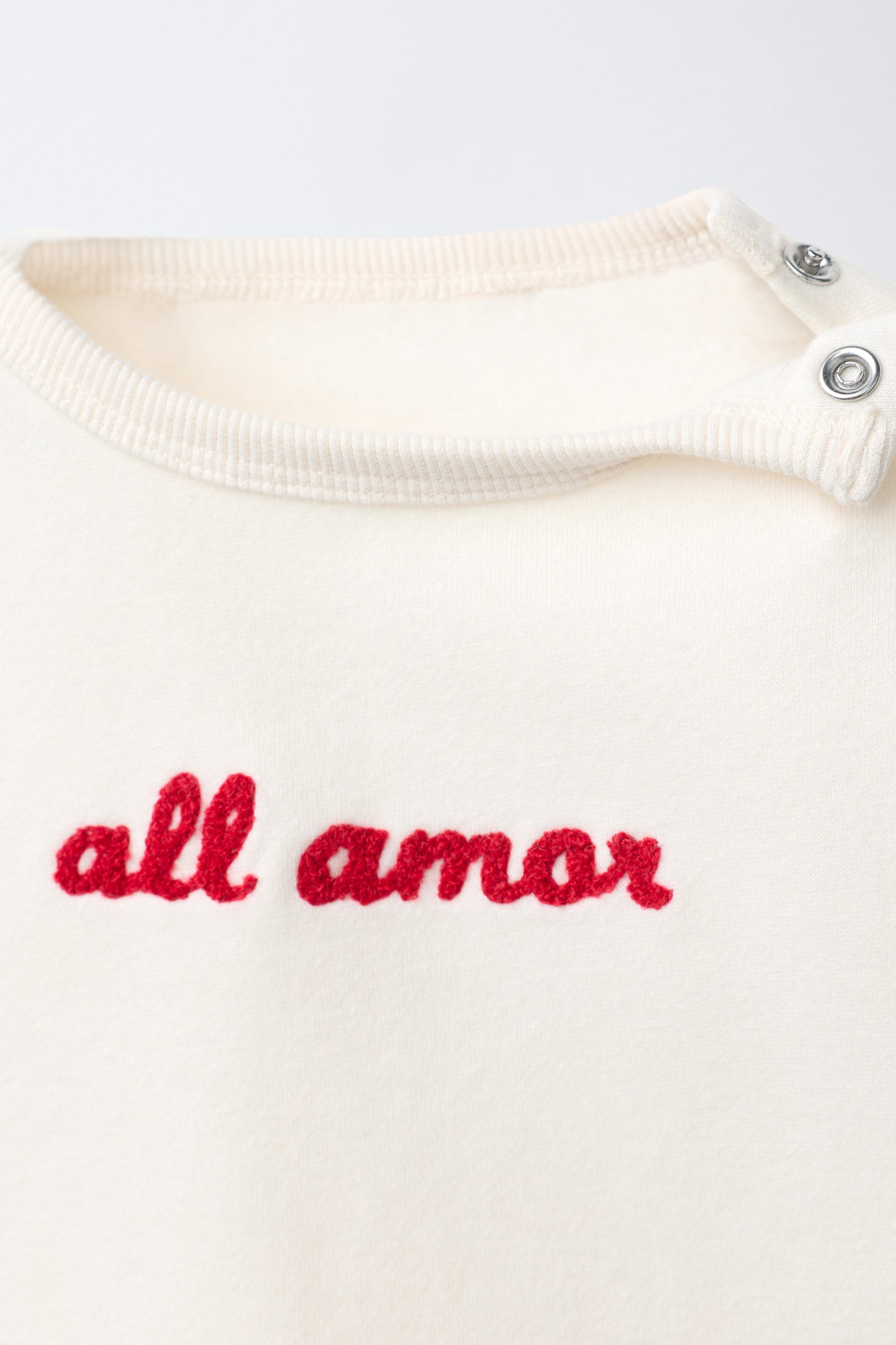 Two-piece set. Round neck sweatshirt with long sleeves. Ribbed trim. Snap button closure at shoul... | Zara US