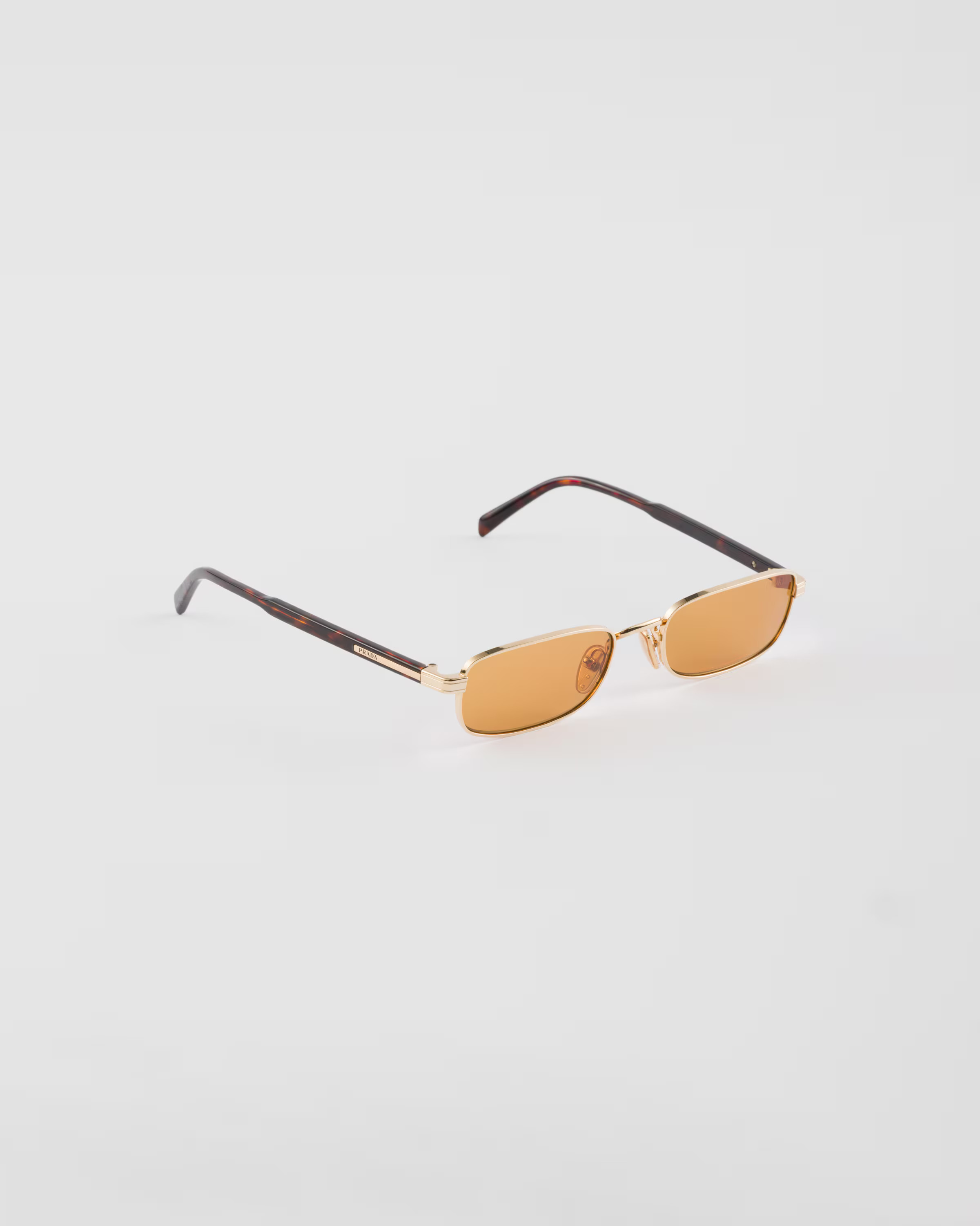 Sunglasses with the iconic metal plaque | Prada INT