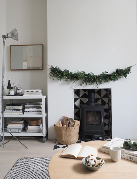 A simple festive scene, with a homemade garland and a cosy fireplace - so easy to recreate the look with one of The White Company’s faux garlands if you don’t want the hassle 🎄🌿 #minimalistchristmas #scandichristmas 

#LTKhome #LTKSeasonal #LTKHoliday