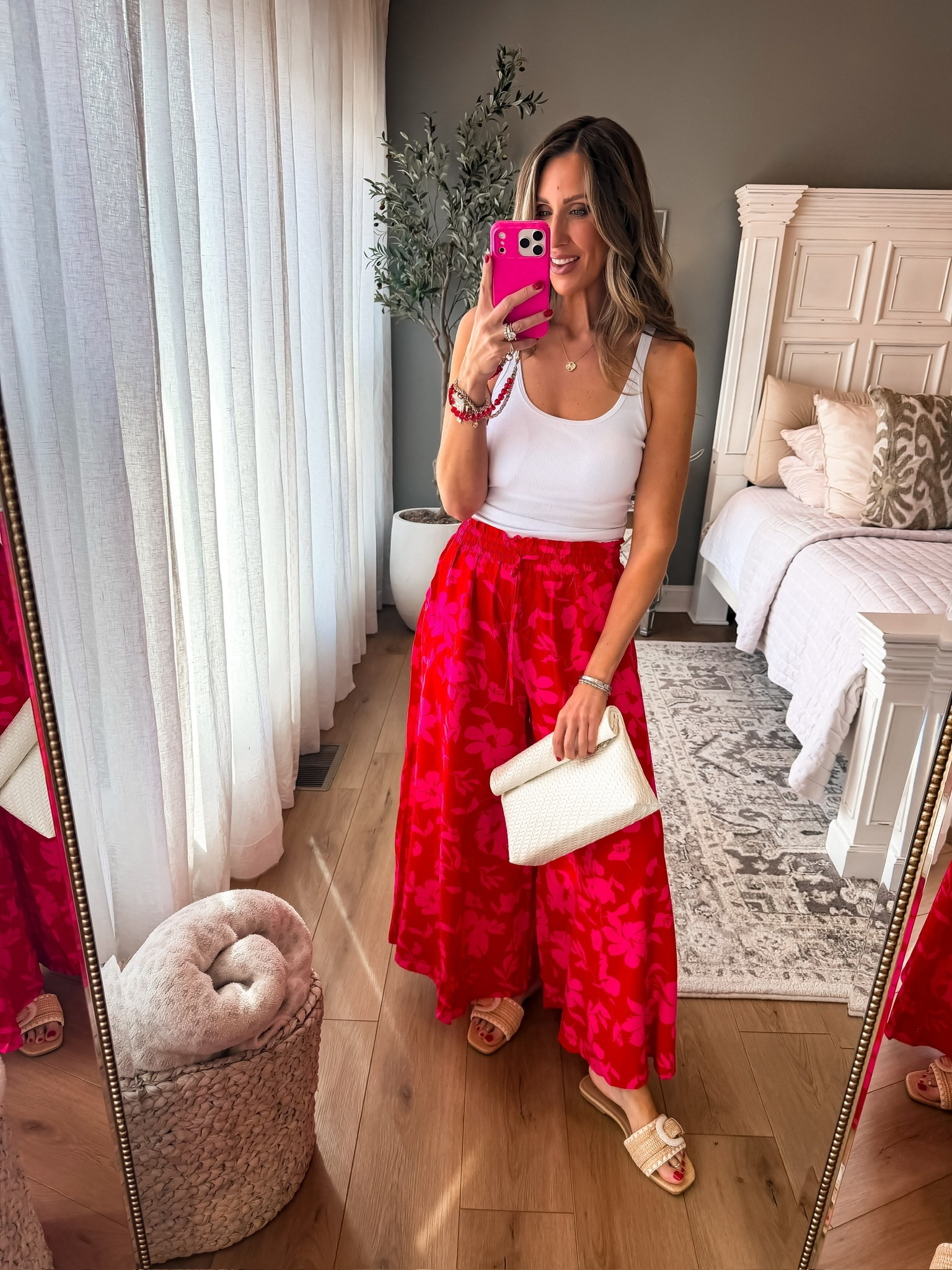 Obsessed with this pink floral pants moment 💗 The flowy fit and bold color make this such a fun summer outfit, and I love how easy it is to style with a simple white tank and neutral accessories. Perfect for vacations, brunch, summer dinners, or any event where you want to feel cute but comfortable.

pink floral skirt, summer outfit idea, colorful vacation outfit, resort wear style, casual chic outfit, flowy maxi skirt, feminine summer fashion, vacation dinner outfit, bright summer look, easy elevated outfit, brunch outfit inspo, themominstyle

#LTKBeauty #LTKOver40 #LTKSeasonal