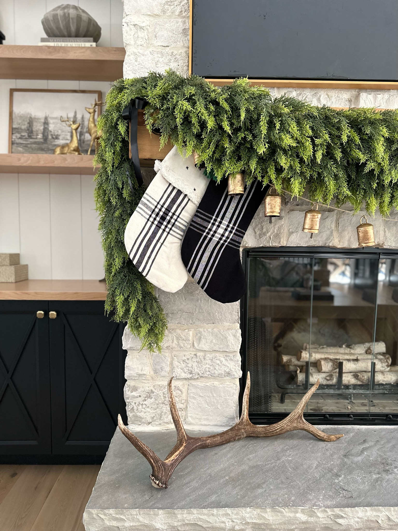 Cedar garland from Hobby Lobby but similar options linked.  Cedar and neutral mantle display. 

#LTKhome #LTKHoliday #LTKSeasonal