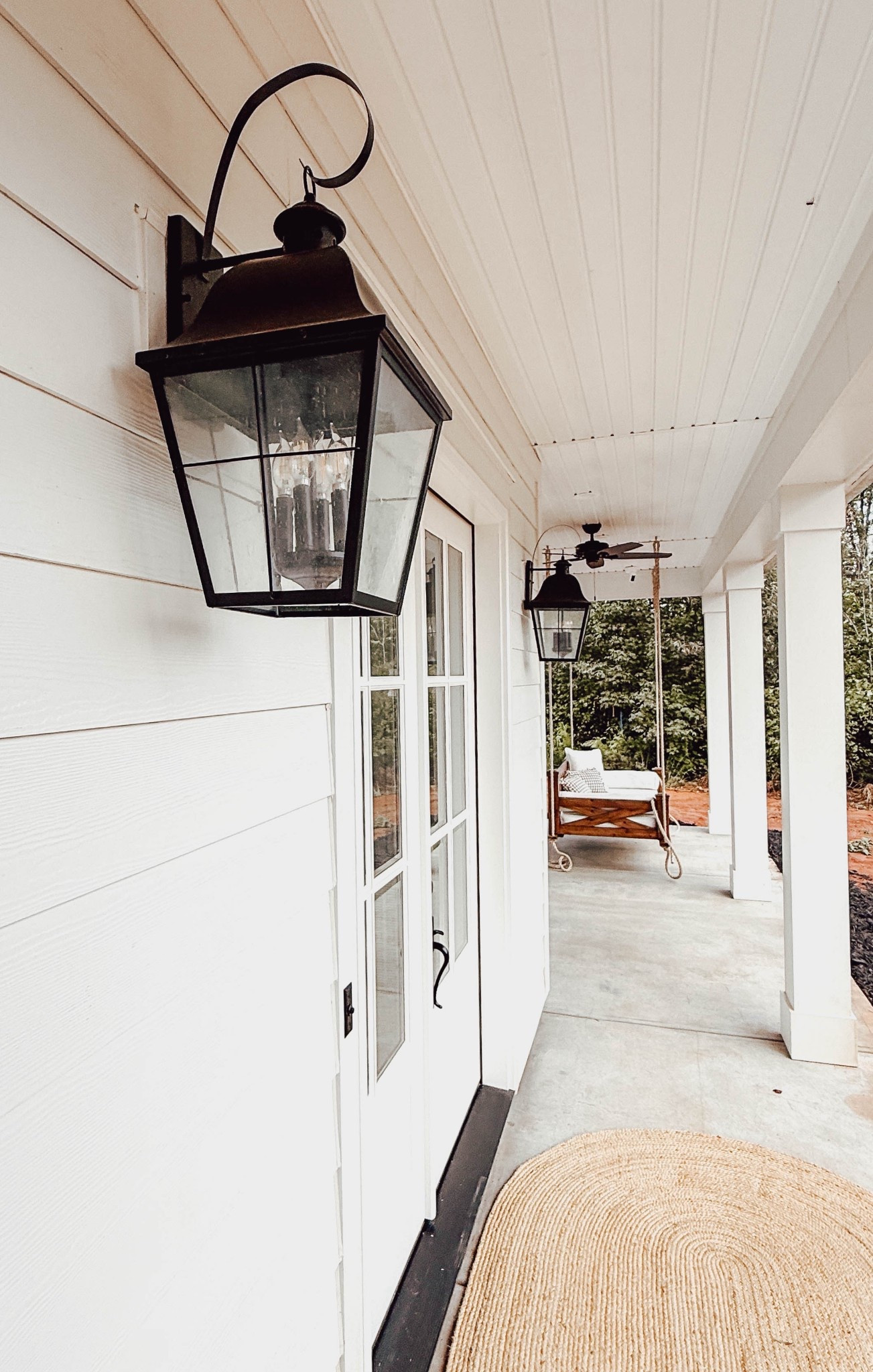 Adore these carriage style lights on our front porch, over the garage, and the back of the house. 🖤
.
#carriagelights #porchlighting #porchlights #lanternlighting #exteriorlighting #farmhouselighting #frontporchlights #lanternstylelighting #cottagefarmhouse #cottageexterior

#LTKHome