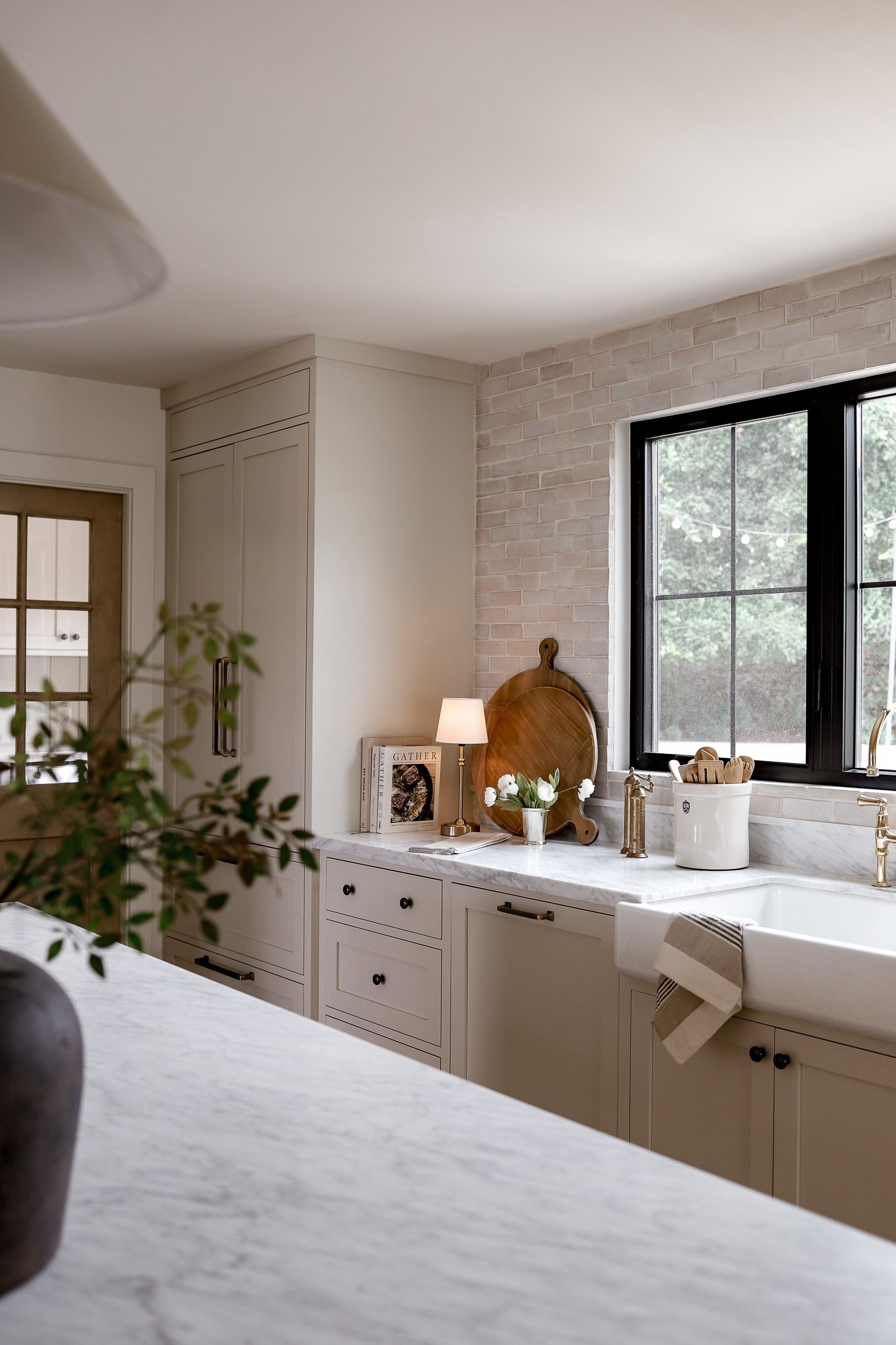 Shop our kitchen! Paint is Benjamin Moore Swiss Coffee on the walls and ceilings. Benjamin Moore Natural Cream on cabinets. White oak is a custom stain. Tile is Natural Zellige from Riad Tile. Linked the Zellige from Bedrosians which is the same! 🤍 

#LTKHome #LTKSeasonal #LTKSaleAlert