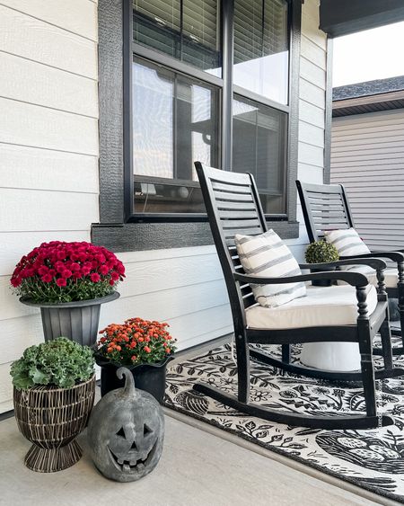 I’m using plum and bronze mums, faux pumpkins, a fern wreath and gray, black and rattan planters on my front porch this year. 

Porch rockers, outdoor decor, outdoor rugs. 

#LTKSeasonal #LTKstyletip #LTKhome