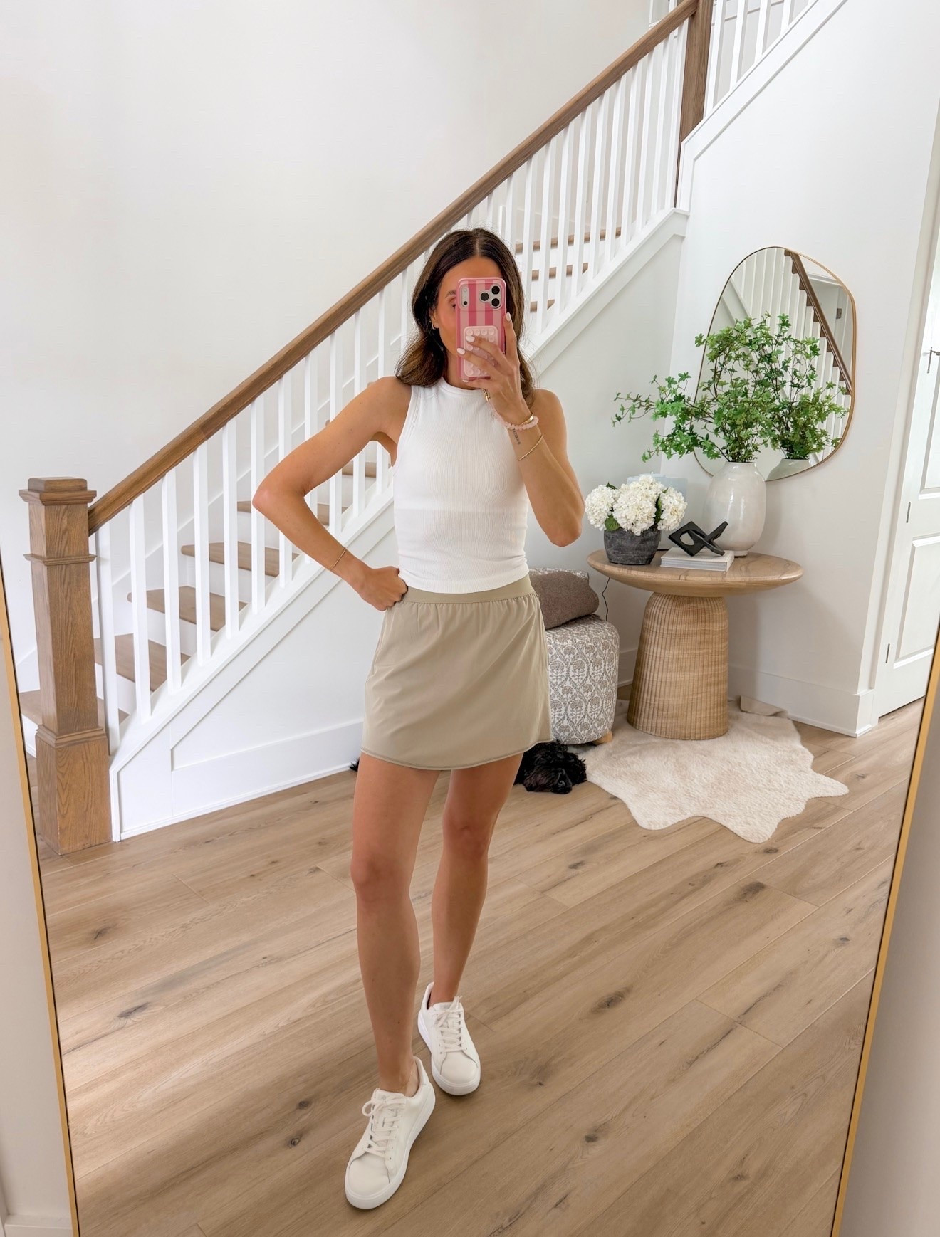 Bestseller! This skort is one of those pieces that makes getting dressed easy. It has the polished look of a skirt with the comfort of built-in shorts, making it perfect for errands, walks, travel days, and everyday summer outfits. Paired with a simple tank and white sneakers, it’s an effortless warm-weather look.

Skort outfit, Summer style, Casual outfit, Everyday fashion, White tank top, Neutral outfit, Travel outfit, Comfortable style, Athleisure outfit, Summer essentials, Weekend wear, Easy outfit idea, annabrstyle

#LTKActive #LTKootd #LTKOver40