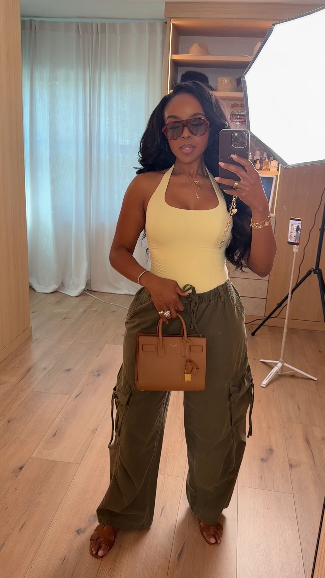 Effortless off-duty energy 🤎 A structured halter tank paired with relaxed cargo pants is that perfect balance of fitted and flowy. The cinched waist keeps it flattering, while the utility pockets add that cool-girl edge — and when you style these cargos with heels, sneakers, or sandals, the cost per wear keeps dropping.

The neutral top keeps everything clean and minimal, making this an easy repeat outfit you can dress up or down depending on the vibe.

Perfect for: brunch, travel days, casual date night, errands, vacation outfits beach, and everyday elevated style.

📏 Sizing:
Wearing size Small in the top  
Wearing 4 Long in the pants  

📐 Measurements:
5’4” · 138 lbs · 34D · 27” waist · 40” hips  

Tap to get details and save to restyle later.

This post includes cargo pants outfit, olive green trousers, halter tank outfit, casual chic outfits, travel day outfit ideas, elevated basics, neutral summer styling, and everyday effortless fashion.

Follow me on Instagram and YouTube @kirasfashionfinds