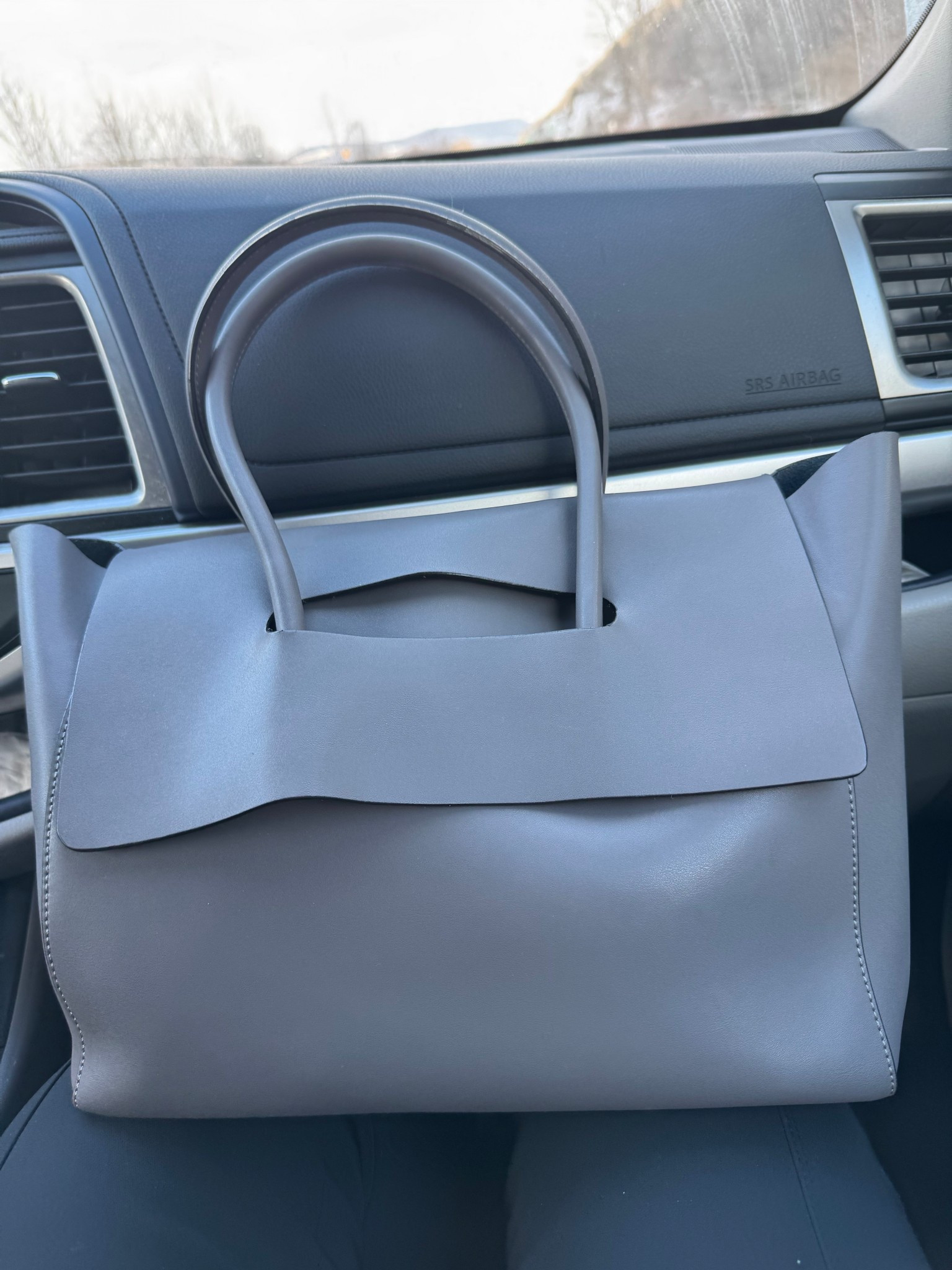 My favorite grey leather bag. I love it due to how spacious it is and modern, well made from leather .#LTKbag#LTKwomensstyle#