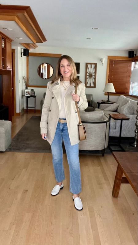 Let's transition into spring! Here’s my outfit of the day. I'm wearing a light cashmere sweater, cropped, midrise bootcut jeans, a trench coat, and my favorite loafers! Plus, a DeMellier crossbody bag. 😊

#LTKVideo #LTKover40 #LTKSeasonal