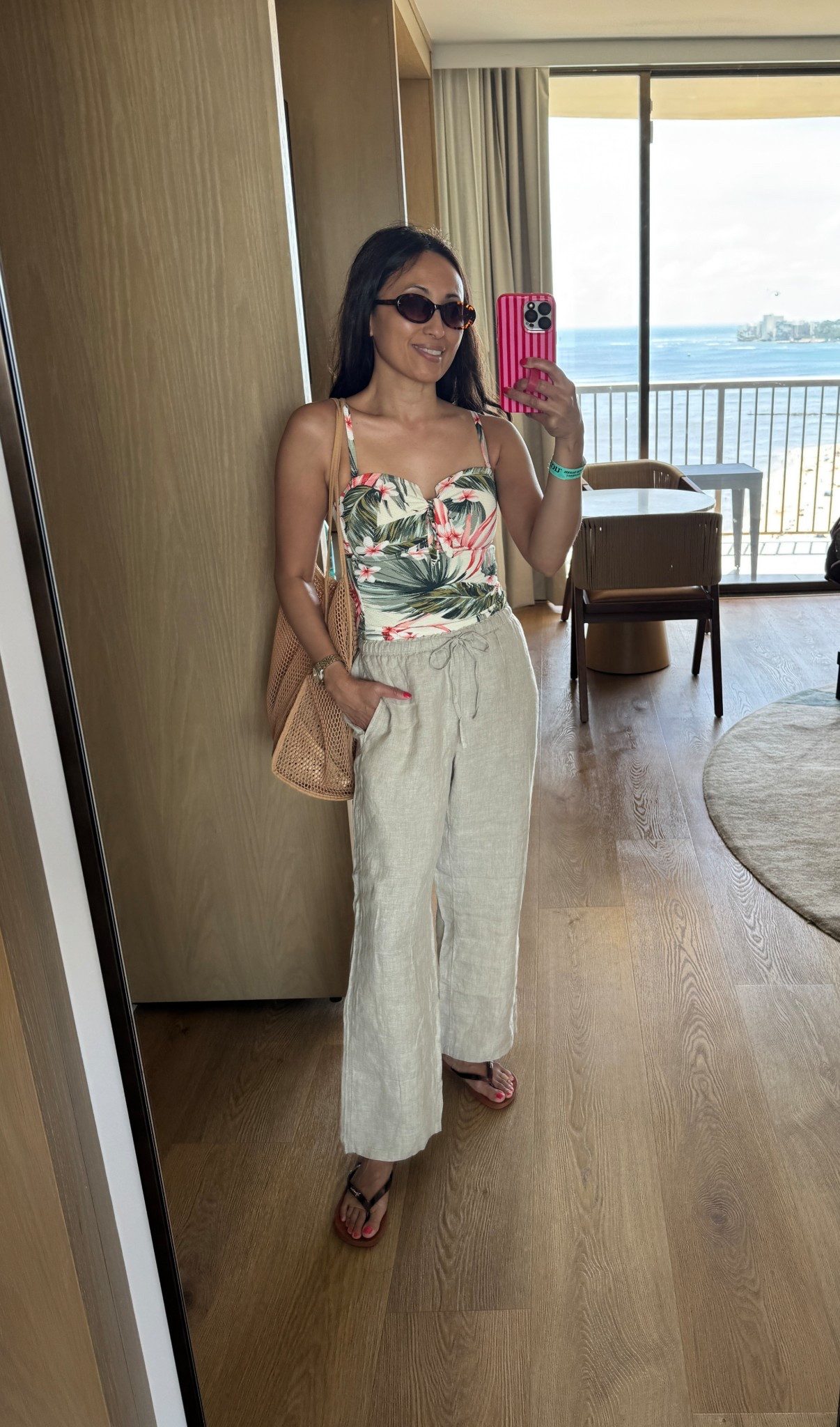 Vacation outfit. Spring break. 
Swim. Pool. Beach. 
Swimsuit is older, but linking similar current season. 
I love these relaxed linen pants for a swimsuit coverup or to wear as casual pants. True to size. 
Beach bag. Pool bag is old, but still like new. 
New favorite style of sunglasses. Great quality and fit. I have in black too. 
Comfy flip flops  

#LTKootd #LTKOver40 #LTKTravel