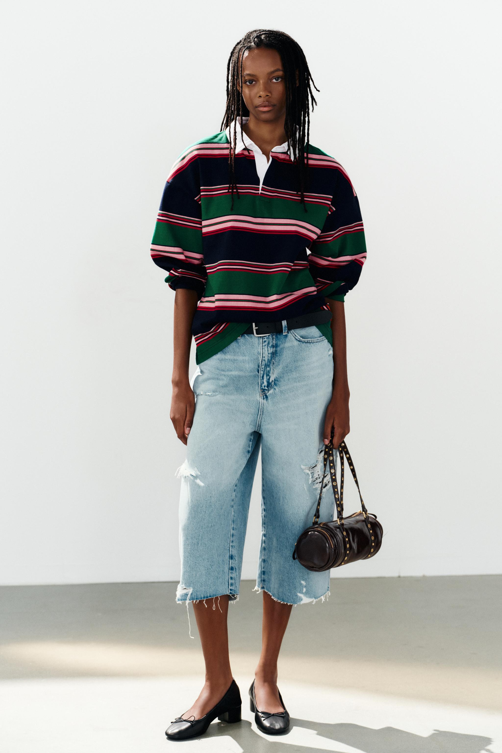 Oversized polo shirt made of 100% cotton. Featuring a lapel collar with a button placket and long... | Zara US