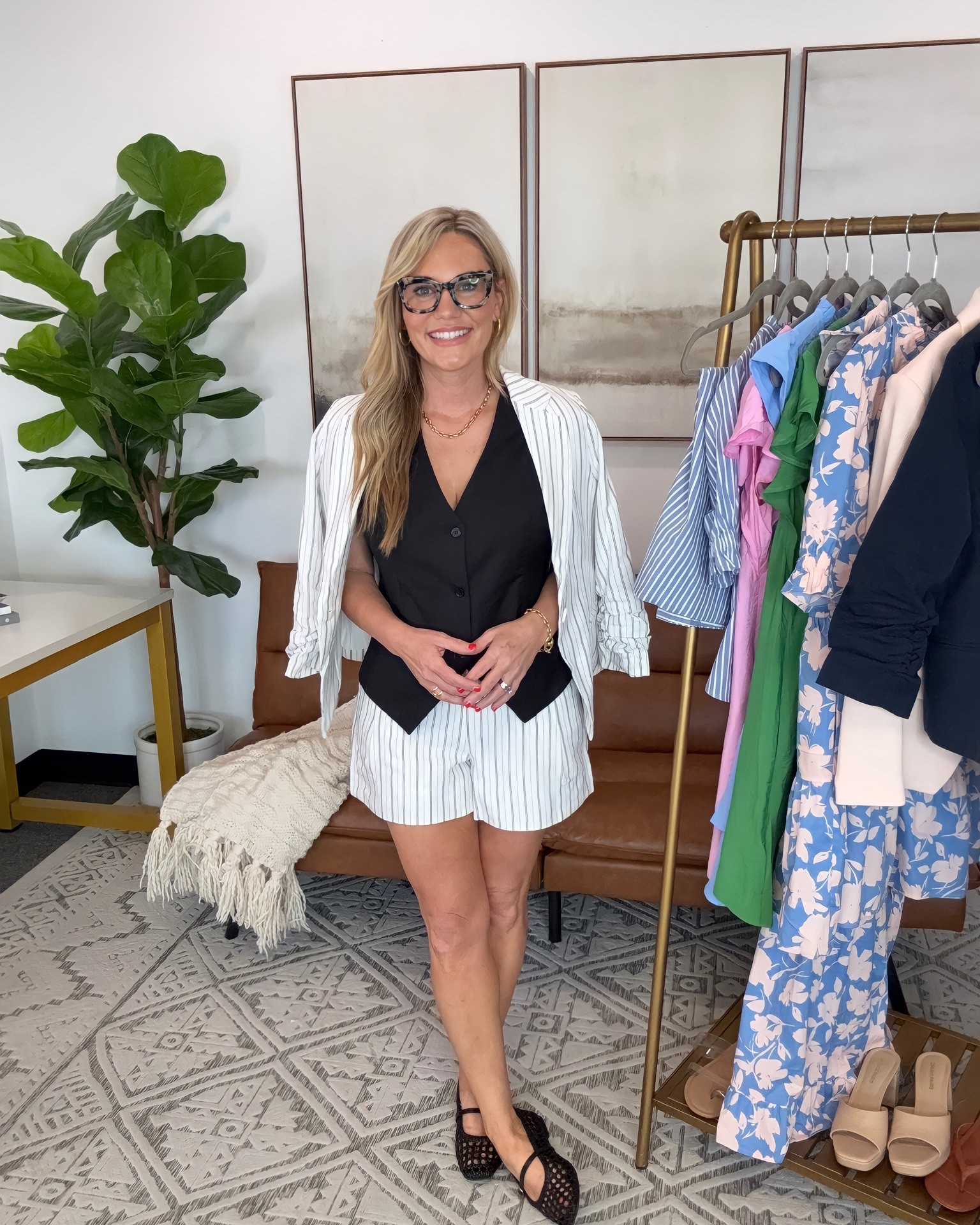 Classic summer workwear with a polished twist. This striped blazer and matching tailored shorts set feels elevated and lightweight for warm office days, and the black vest adds a chic structured layer that makes the whole outfit look more expensive. Finished with woven mesh flats and statement glasses for an effortless business casual look that works for meetings, casual Fridays, or summer networking events.

Top: small
Bottoms: small
Shoes: 7.5
Bra Size: 34DD
Height: 5’2

summer business casual  striped blazer set  tailored shorts outfit  black vest outfit  office outfit inspiration  chic workwear  elevated casual style  summer office fashion  woven flats outfit  neutral workwear  polished summer outfit  petite style inspiration  business casual women  AudrieDollins

#LTKWorkwear #LTKSeasonal #LTKOver40