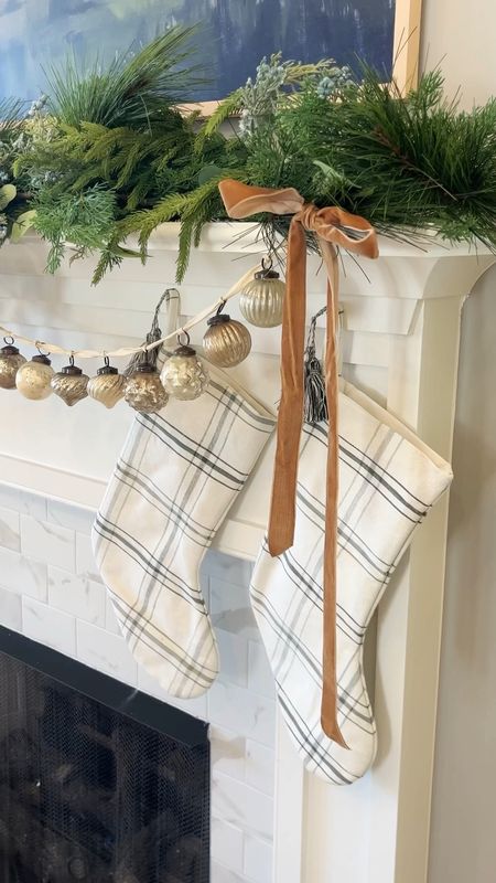Christmas mantel styling! I used the viral Norfolk realistic garland as my base and layered velvet ribbon, stockings, and more greenery for fullness! 

#LTKSeasonal #LTKHoliday #LTKhome