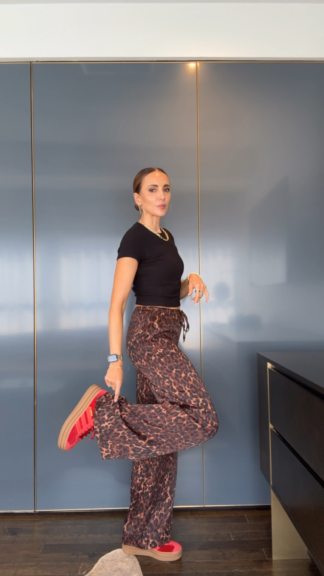 Leopard print satin pants, I’m wearing size 2 . Velvet red sneakers 