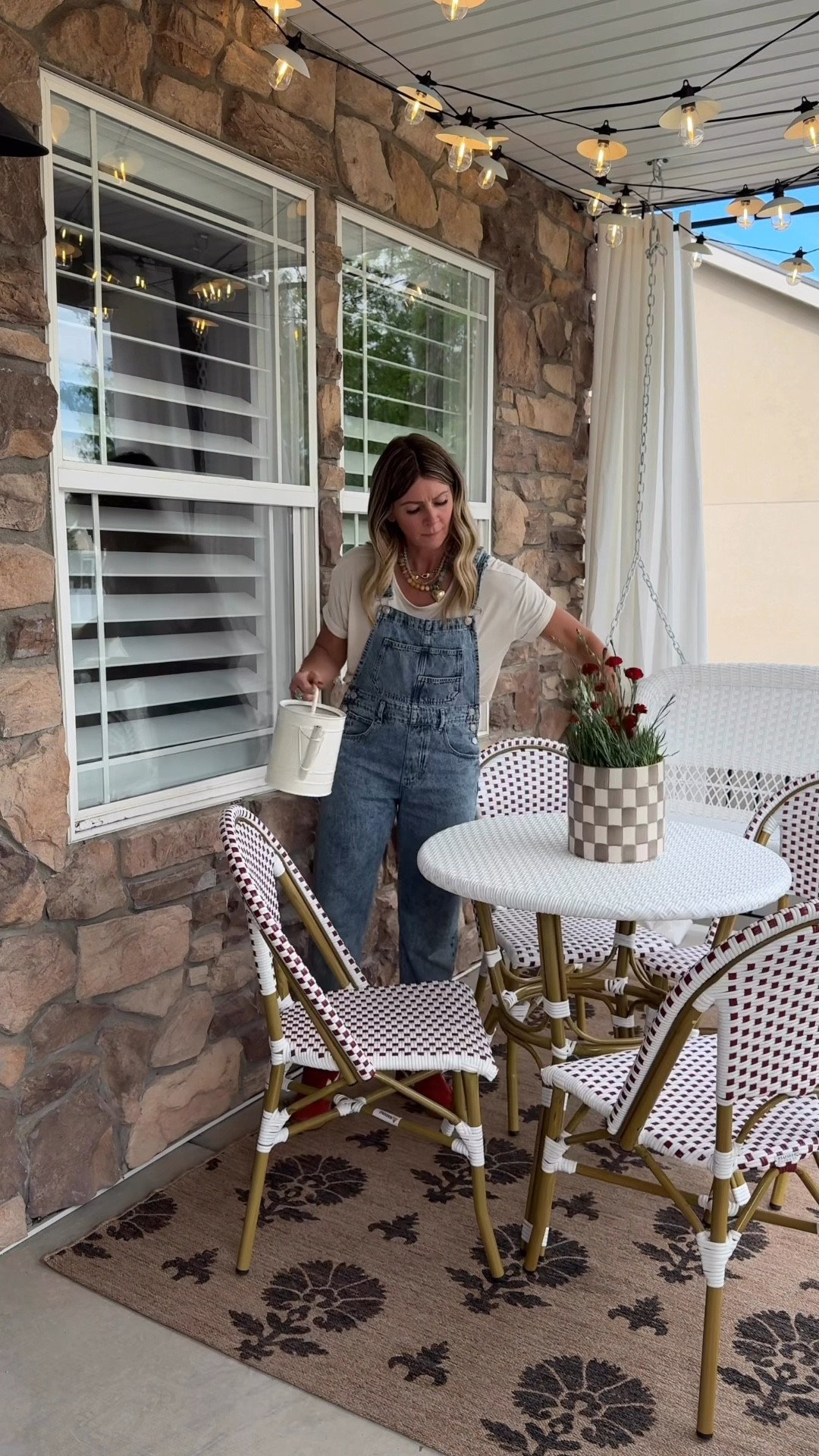 Front porch Cafe’core refresh at my sister's house! We hung curtains, plants, hanging bench, cafe table and chairs all from @target. Love how it compliments the exterior of her home, and of course painted the door for a pop of color that pulls in the landscape so nicely. #ad #TargetPartner #TargetStyle #targetambassadorhome @Target @TargetStyle #Target